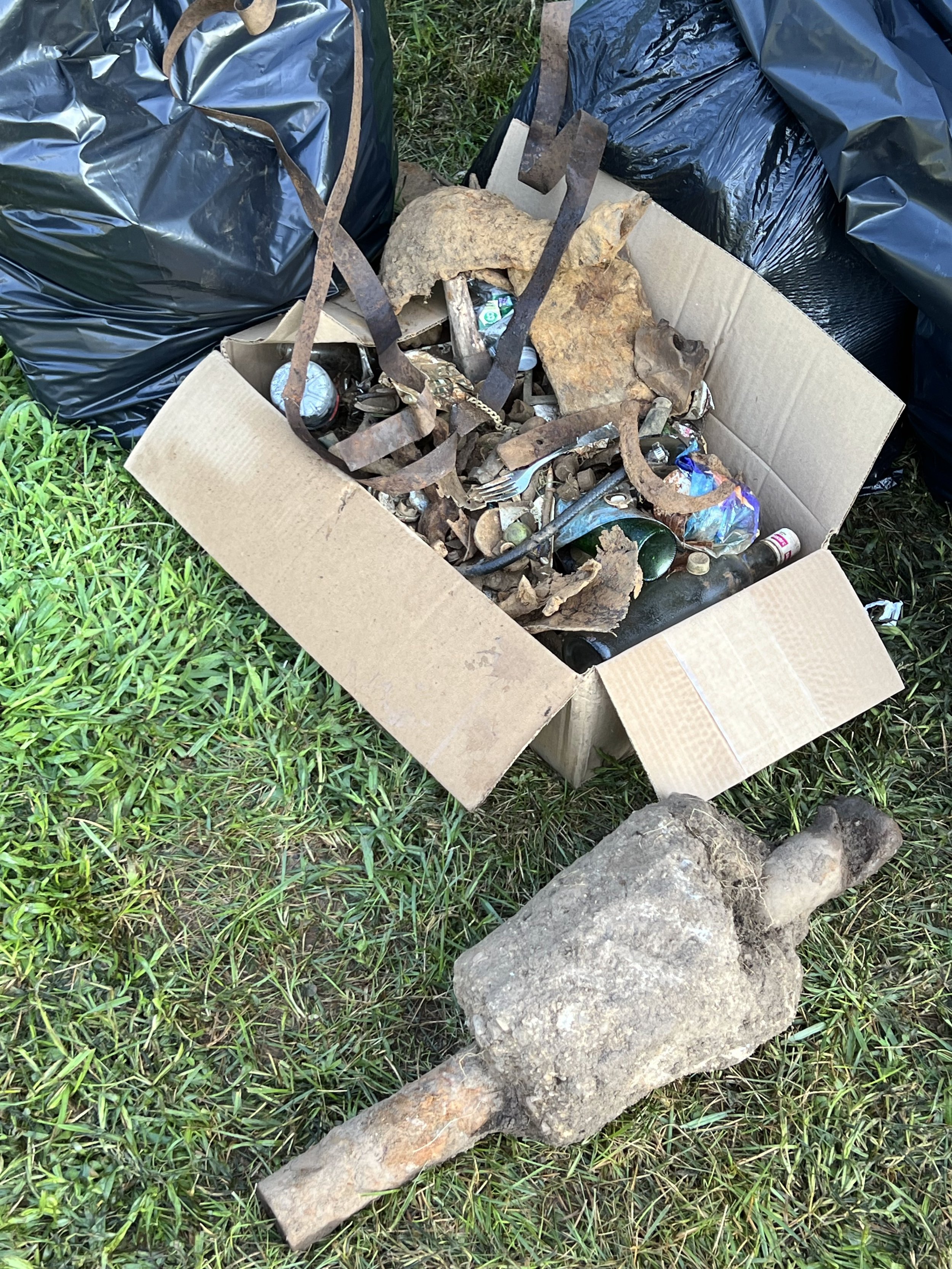 Metal finds and bottles to be recycled or discarded. Aside from relic hunting, detectorists clear trash and recyclables while detecting, leaving areas they explore better than when they started.