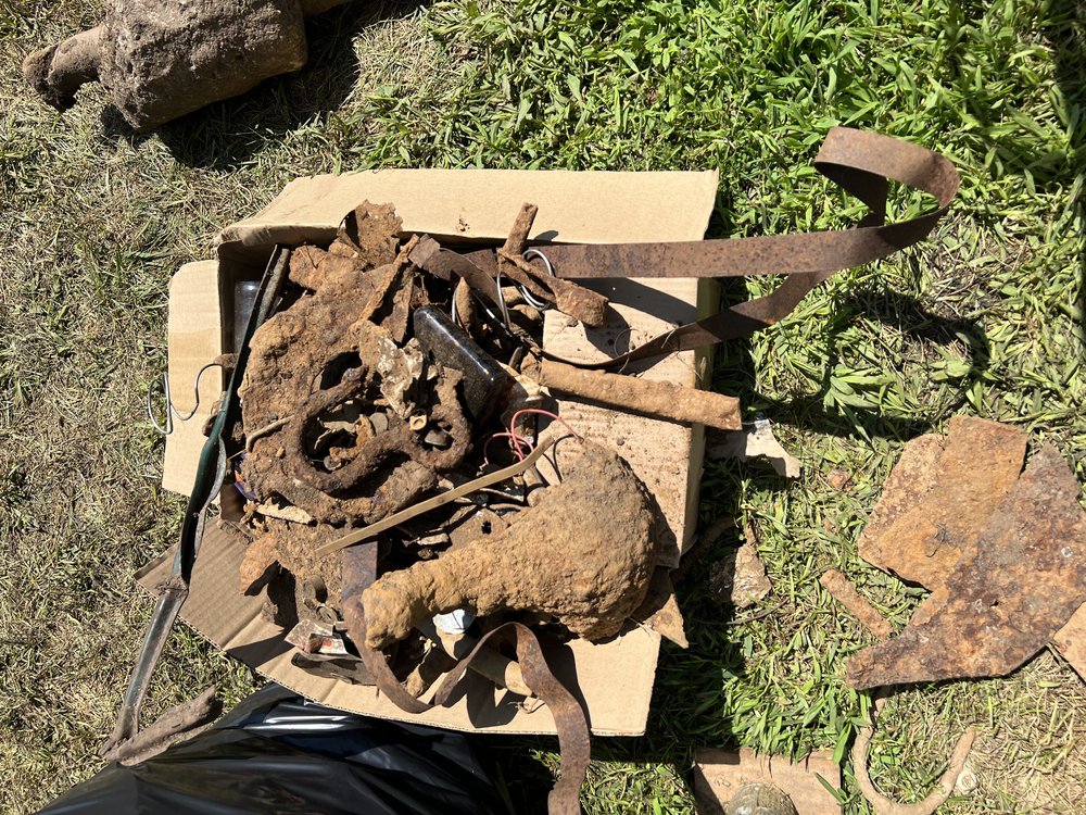 Metal finds and bottles to be recycled or discarded. Aside from relic hunting, detectorists clear trash and recyclables while detecting, leaving areas they explore better than when they started.