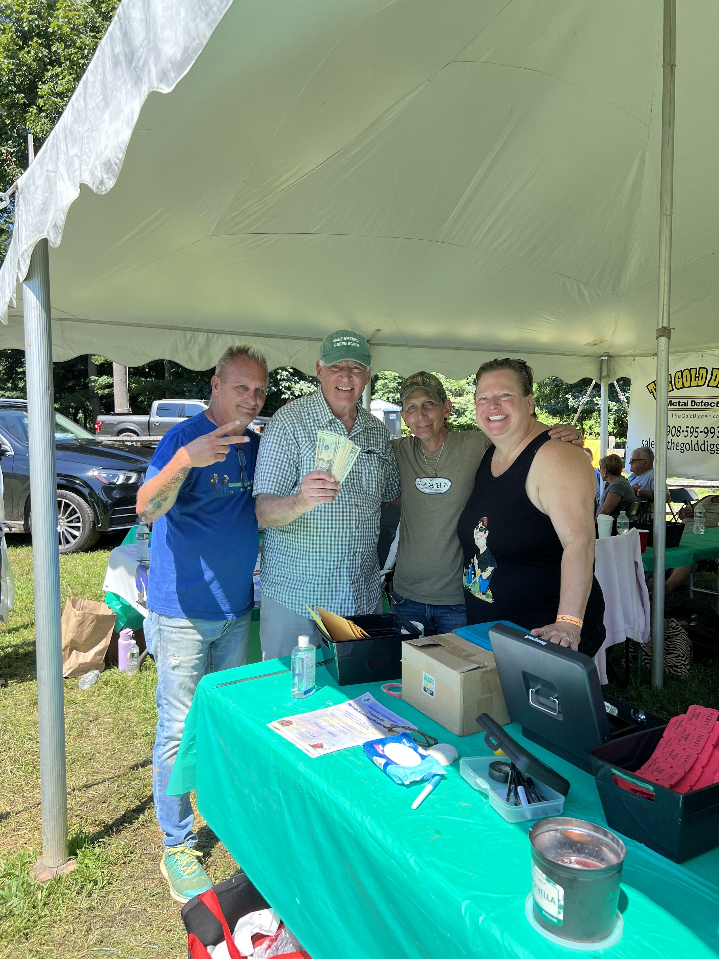 L-R: Bobby Pastor, Bill Kastning, Audra Thomas, Shelli Williams with cash from the raffle donated to MCF