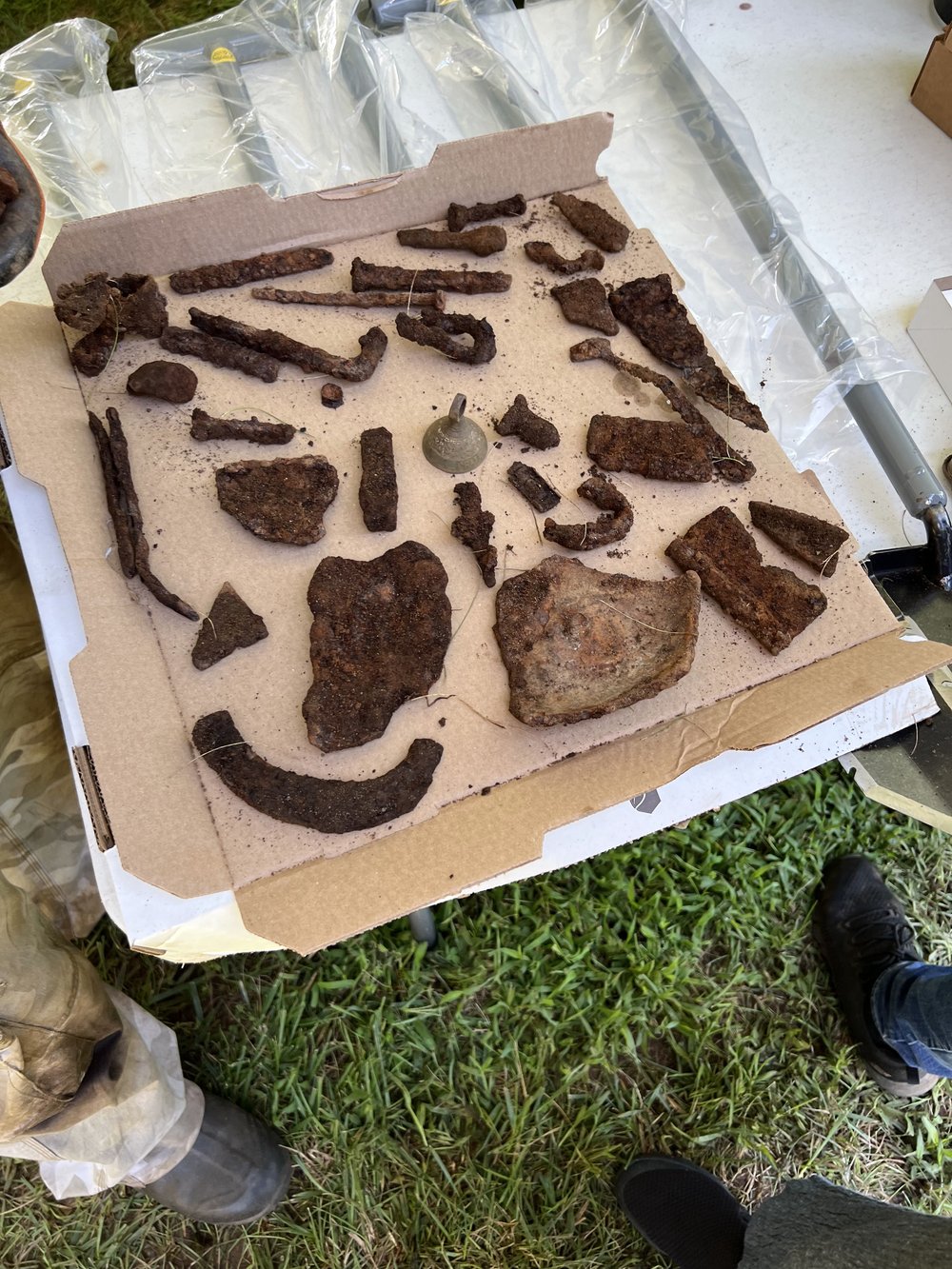 old machinery parts with old horse tack (center)