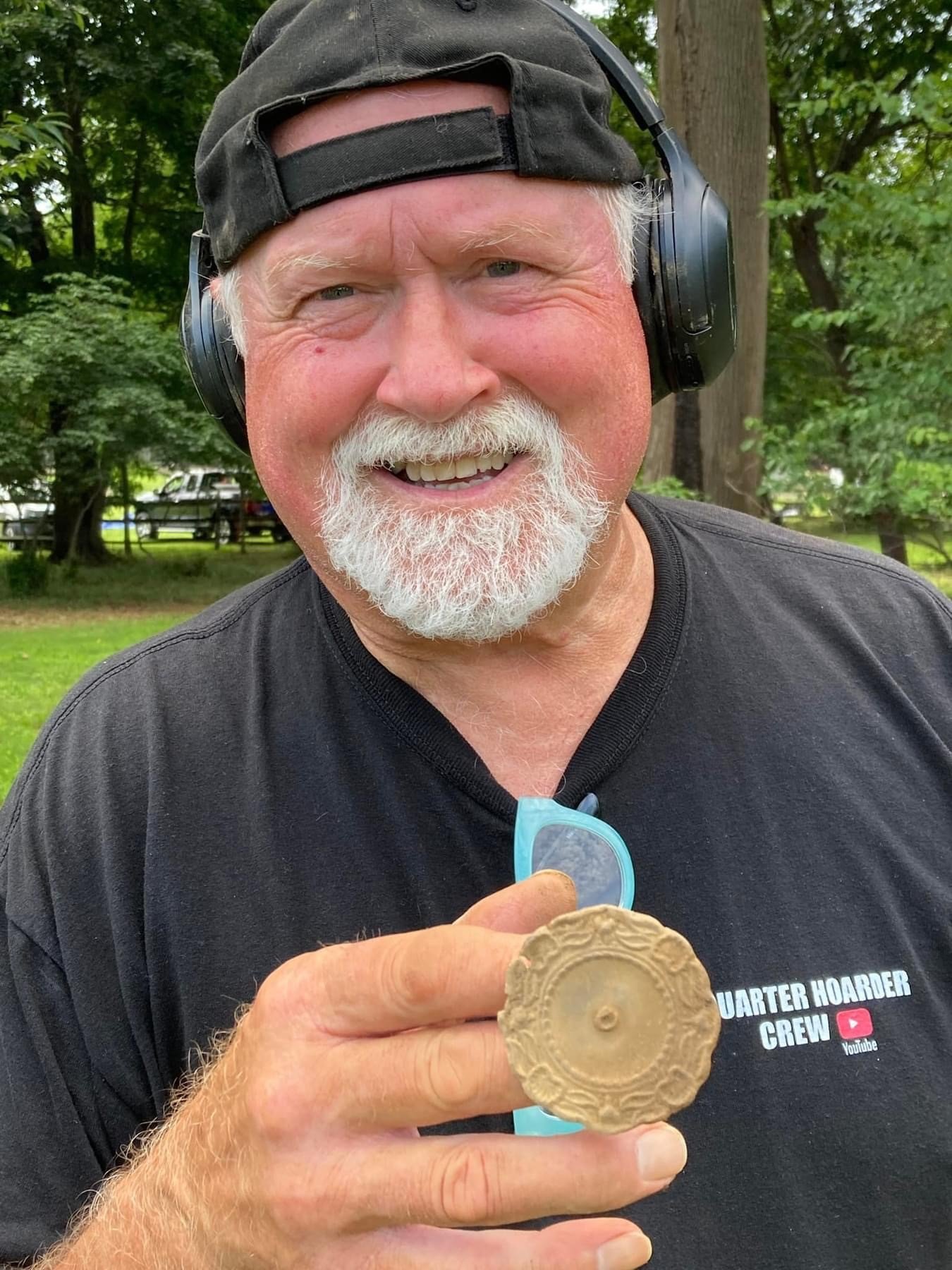 Dog Tag Doug with a horse bridle rosette