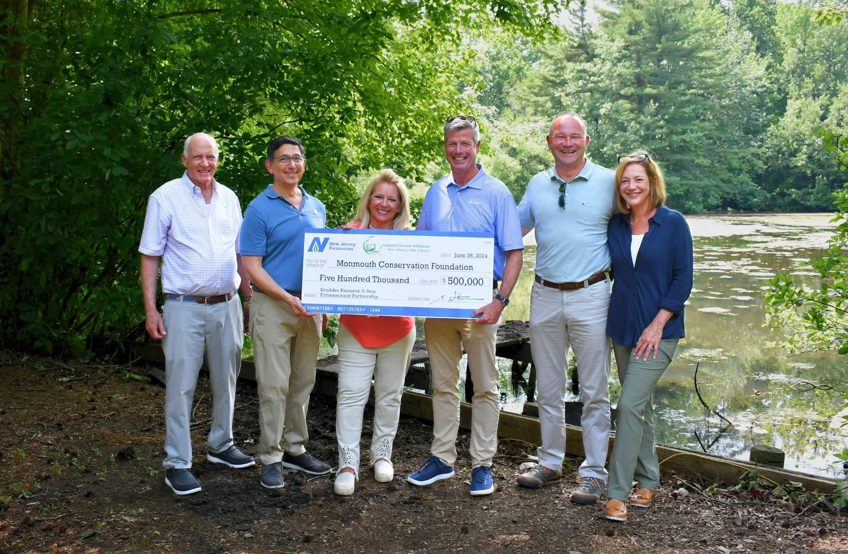 New Jersey Resources (NJR) Executives present $500,000 Donation to Monmouth Conservation Foundation (MCF) at Scudder Preserve, Middletown, NJ. L-R: MCF Executive Director Bill Kastning, MCF Board of Trustees President Matt Cohen, MCF Trustee Valerie Montecalvo, NJR CEO Stephen Westhoven, New Jersey Natural Gas Senior VP and COO Patrick Migliaccio, and NJR Senior VP and COO, Non-Regulated Business, Strategy and External Affairs Amy Cradic. Photo: New Jersey Resources (NJR)