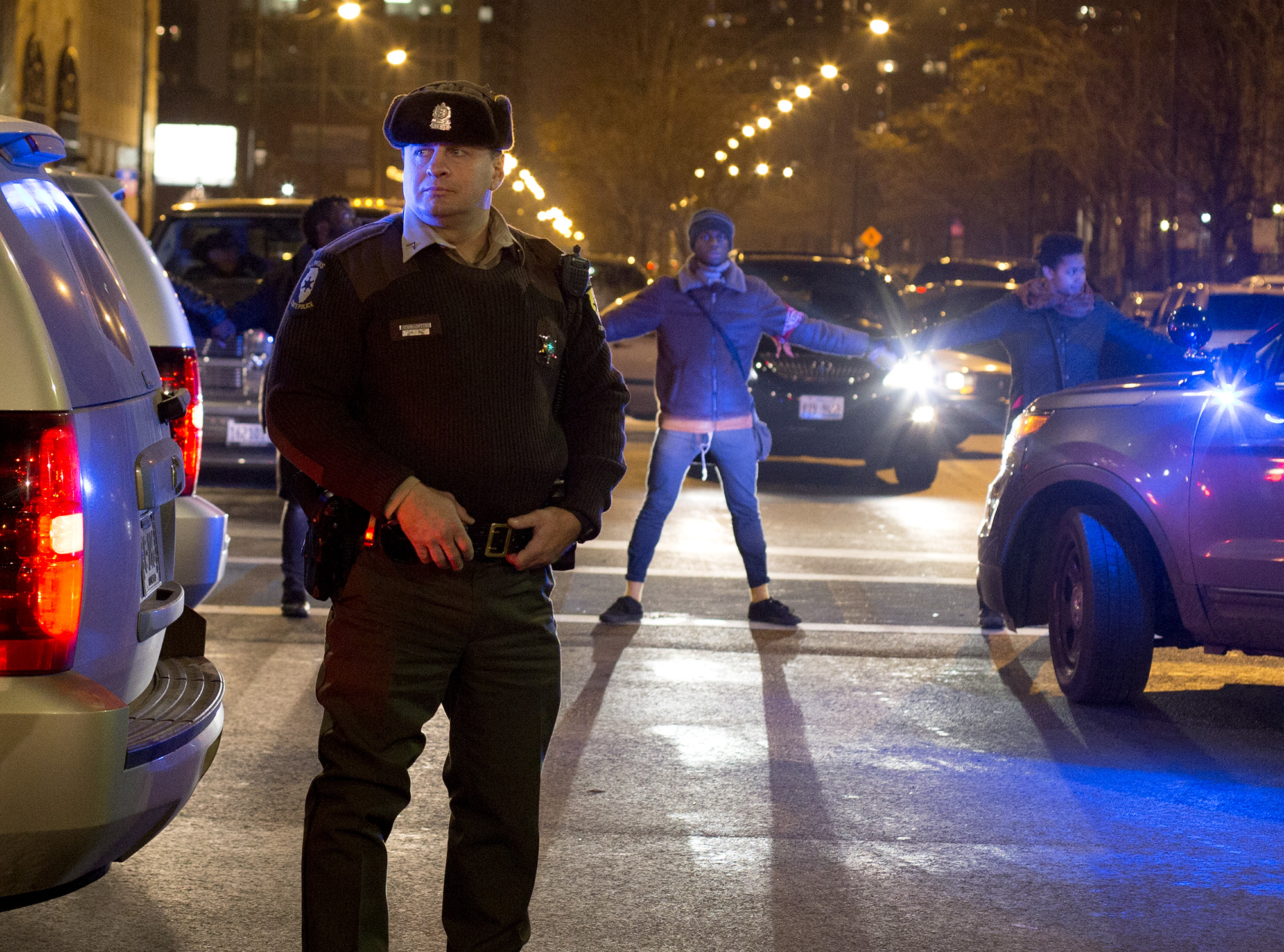 Protester surrounded Chicago police as they protest against police brutality at Roosevelt Station on November 19, 2015.