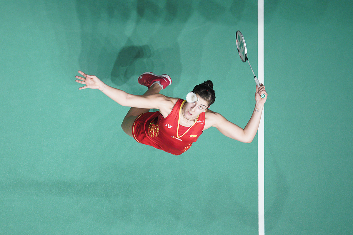 Carolina Marin of Spain returns a shot to Sung Ji Hyun of South Korea during the women's singles quarterfinals of the Malaysia Masters badminton tournament in Kuala Lumpur, Malaysia, Friday, Jan. 18, 2019. (AP Photo/Yam G-Jun)