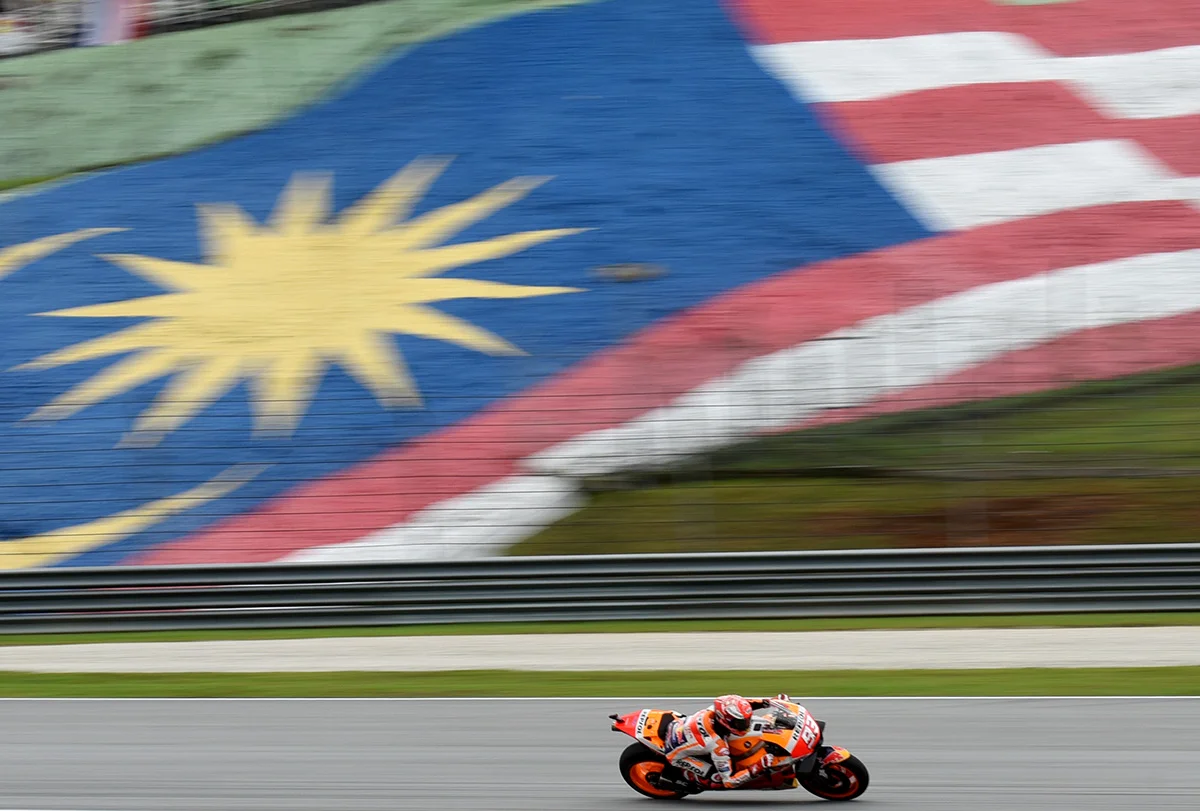 Honda rider Marc Marquez of Spain rides his bike during qualifying at the Sepang International Circuit in Sepang, Malaysia, Saturday, Nov. 3, 2018. (AP Photo/Yam G-Jun)