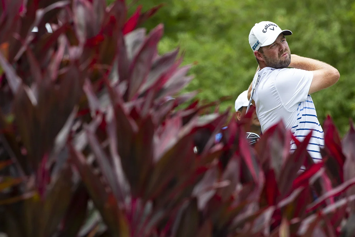 Marc Leishman of Australia follows his shots on the thirteenth hole during final round of the CIMB Classic golf tournament at Tournament Players Club (TPC) in Kuala Lumpur, Malaysia, Sunday, Oct. 14, 2018. (AP Photo/Yam G-Jun)