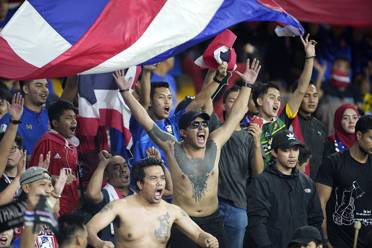 Thailand national football team supporters cheers before the AFF Suzuki Cup semi final against Malaysia at Bukit Jalil National Stadium in Kuala Lumpur, Malaysia, Saturday, Dec. 1, 2018. (AP Photo/Yam G-Jun)