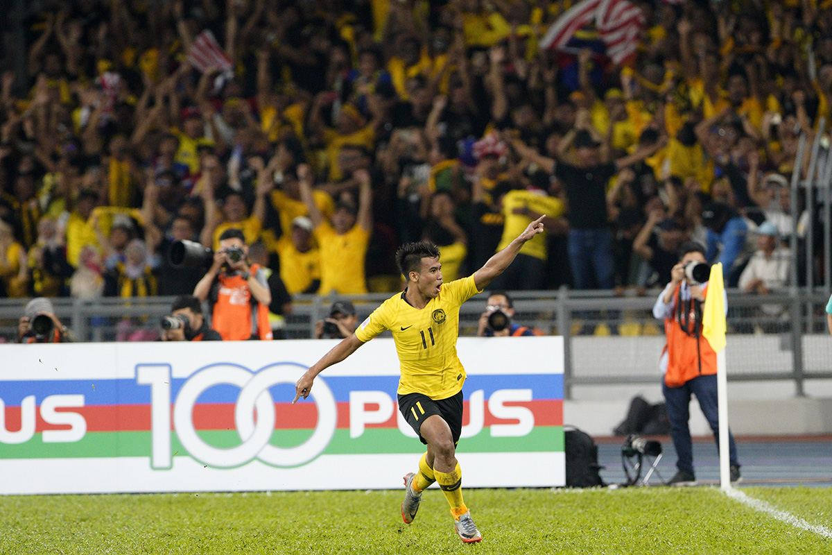 Malaysia's Muhammad Safari Rasid celebrates after scoring during the AFF Suzuki Cup final soccer match between Malaysia and Vietnam in Kuala Lumpur, Malaysia, Tuesday, Dec. 11, 2018. (AP Photo/Yam G-Jun)