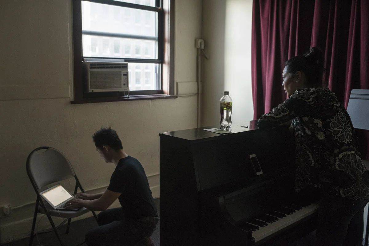 A student records Ms. Chang's feedback during a private singing lesson. G-Jun Yam / NYT Institute