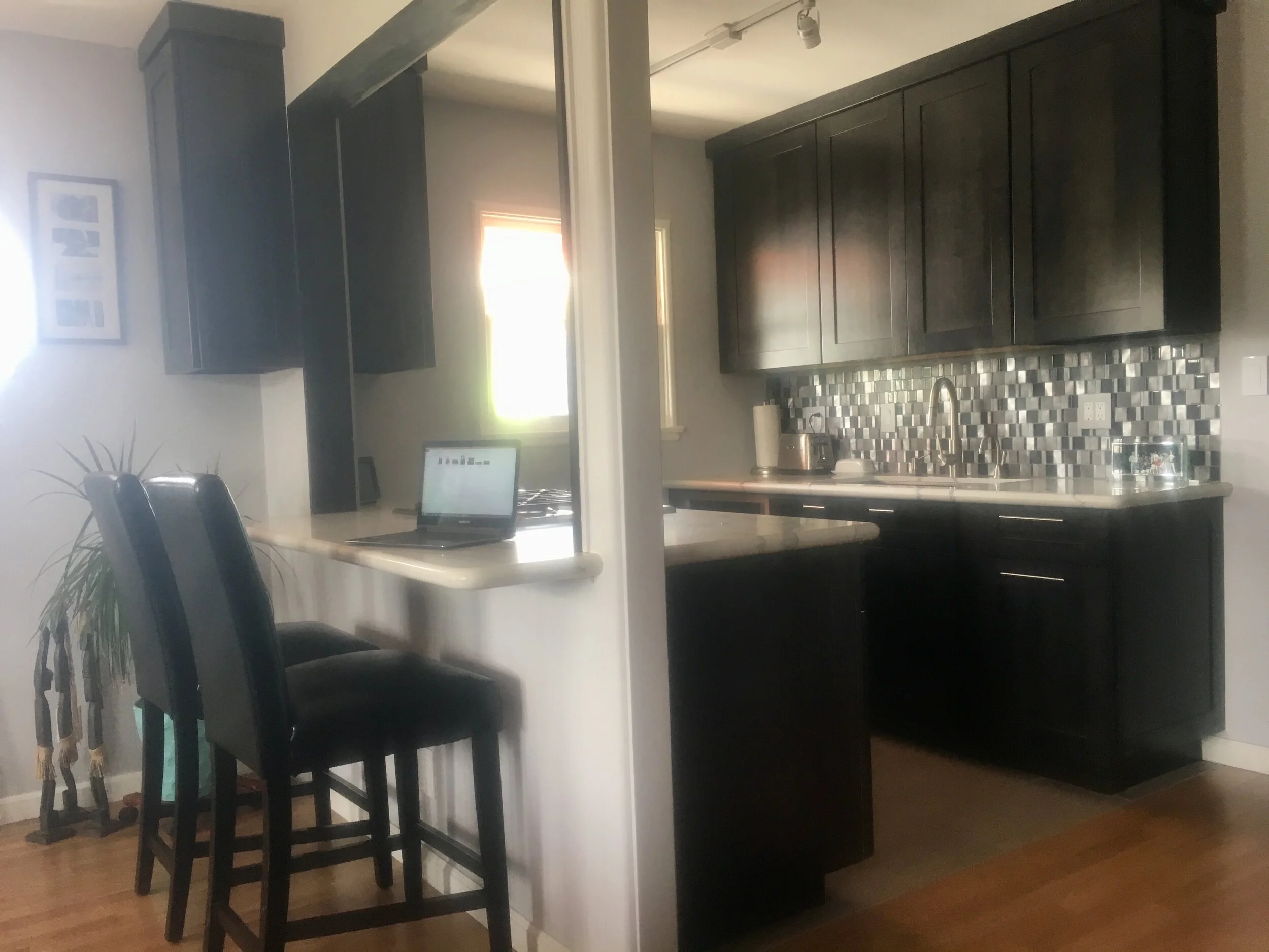 After: built a bar counter which doubles as working and dining space.