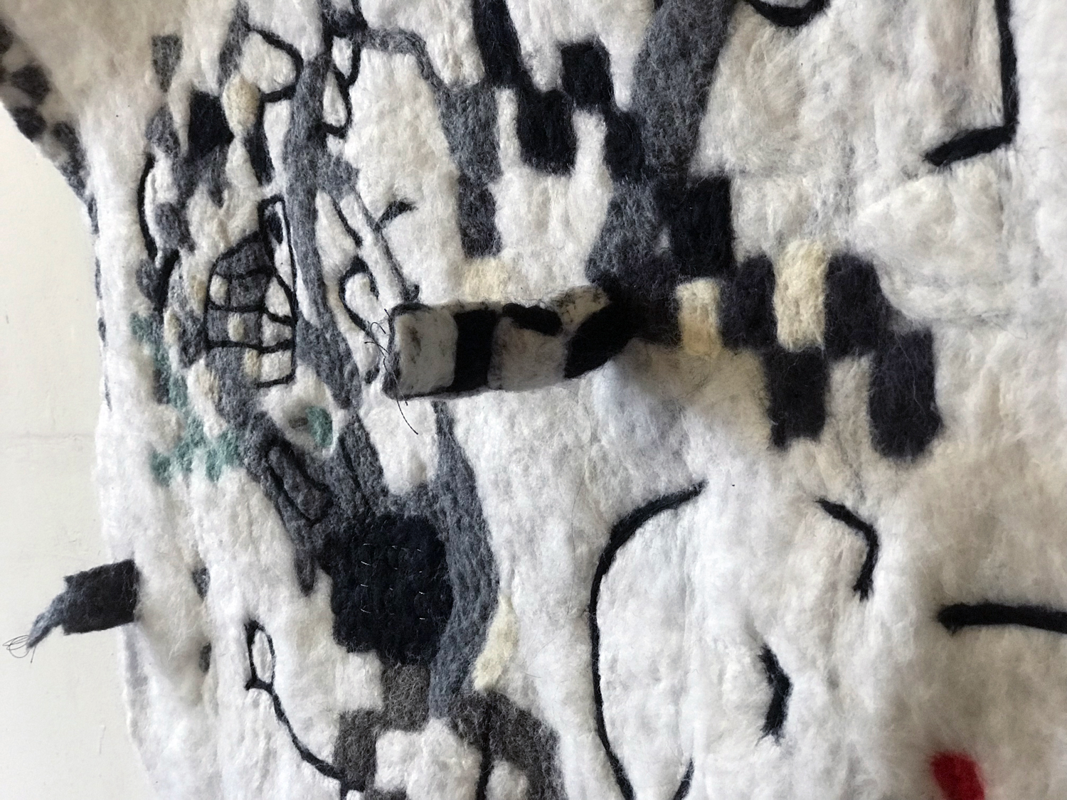 Tina Douglas fuzzy logic 2018, hand felted wool, stainless steel fibre, micro controllers, speakers, sound, painted ply, 91 x 91 cm, detail.