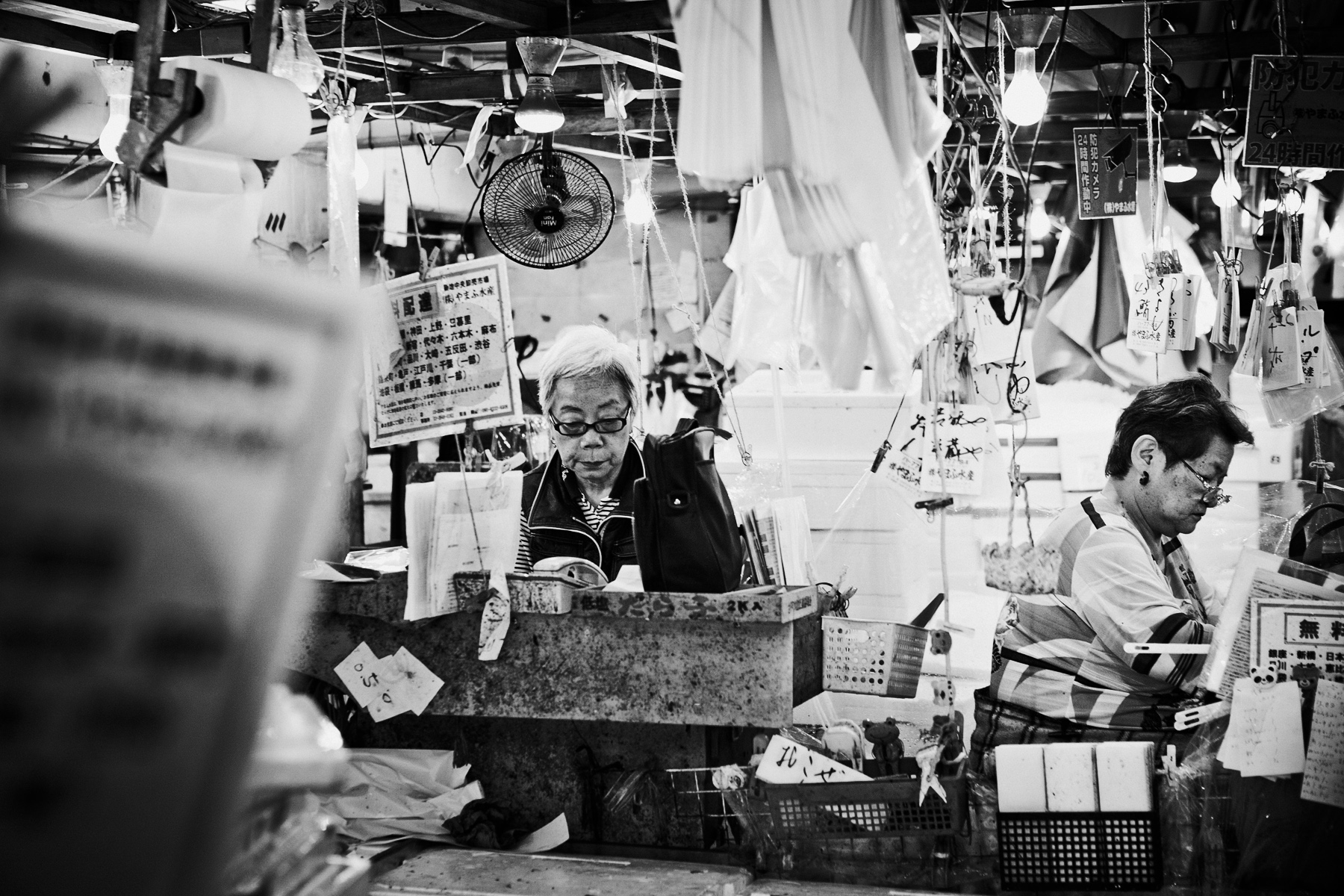 Vendors in tsukiji fish market Tokyo