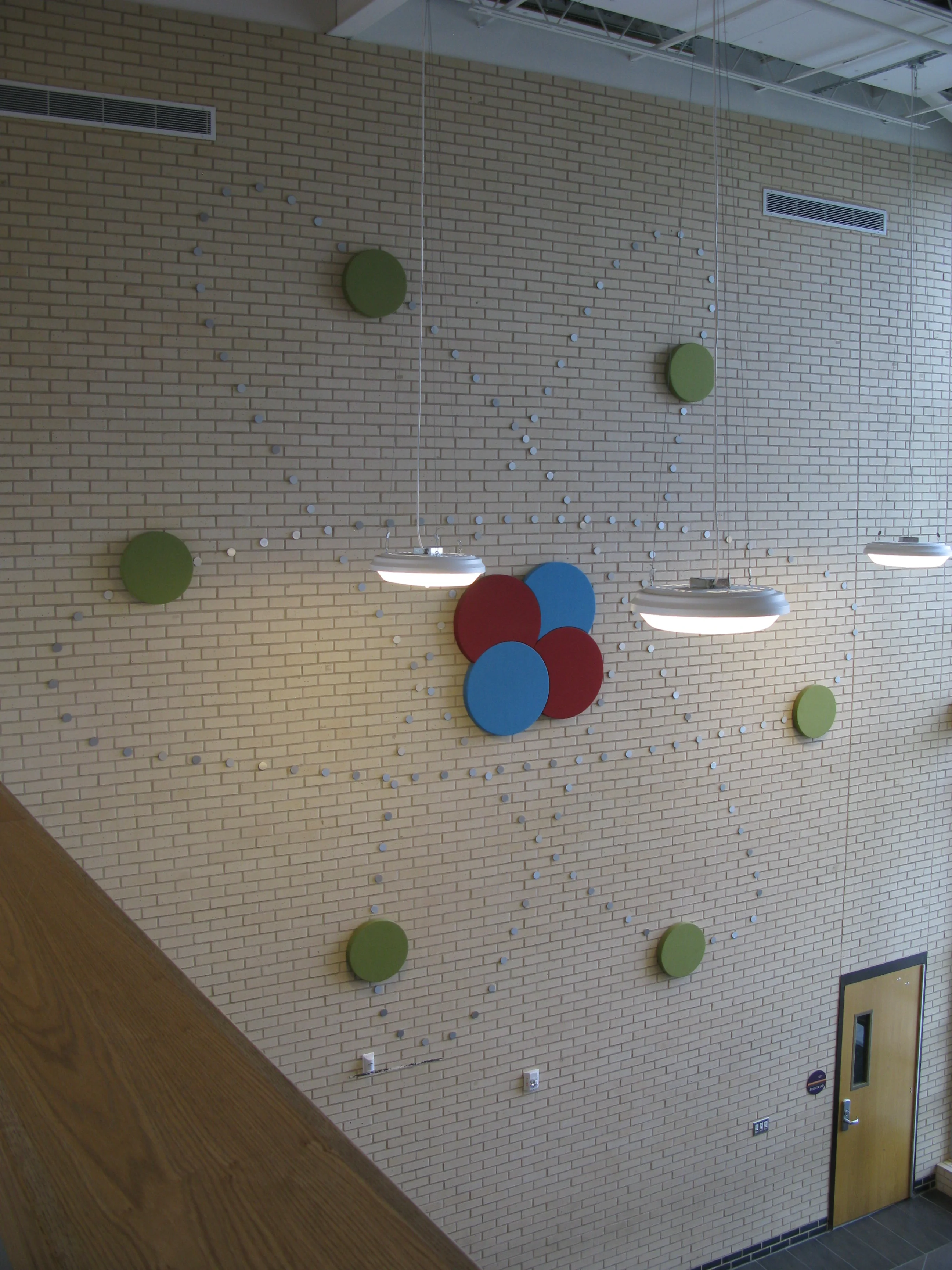  On the left side of the two story atrium just outside of the science labs is a model of the most basic atom, the building blocks of matter. 