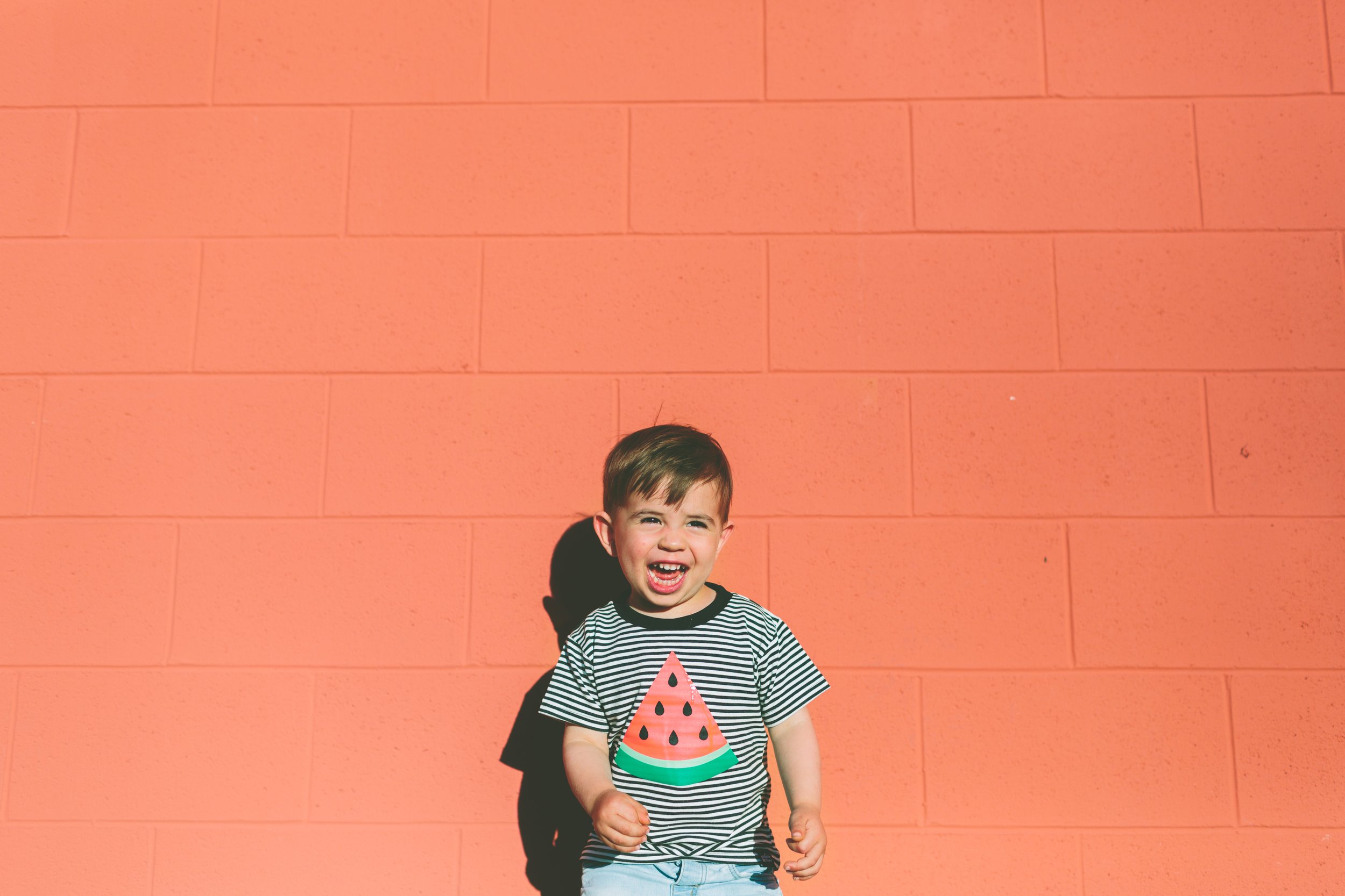 Joyful Pediatric Dentistry: Smiling Kid in Watermelon T-Shirt - Garden City's Bright Smiles