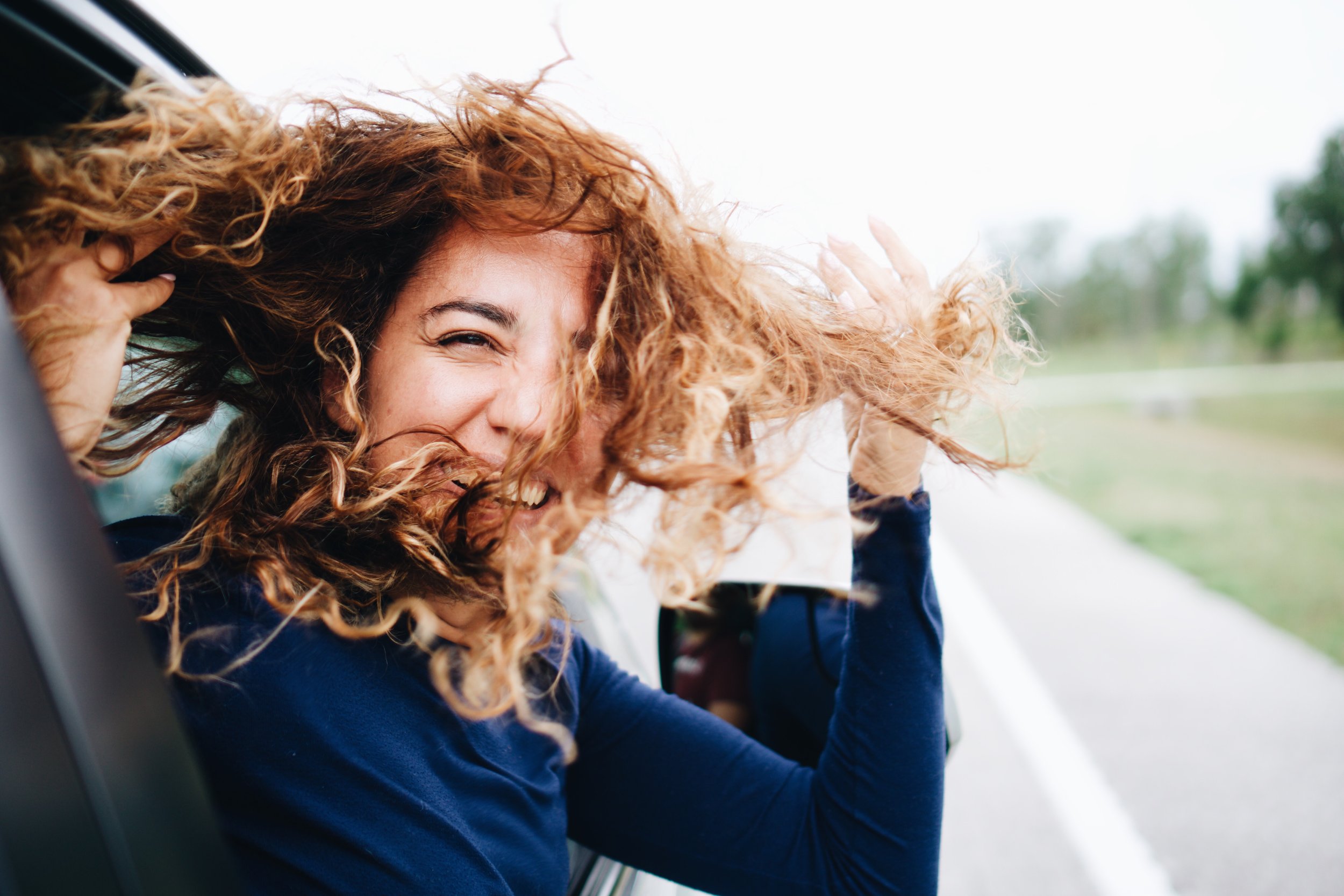 Freedom & Smiles: Woman Enjoying Car Ride - Garden City Dental Health