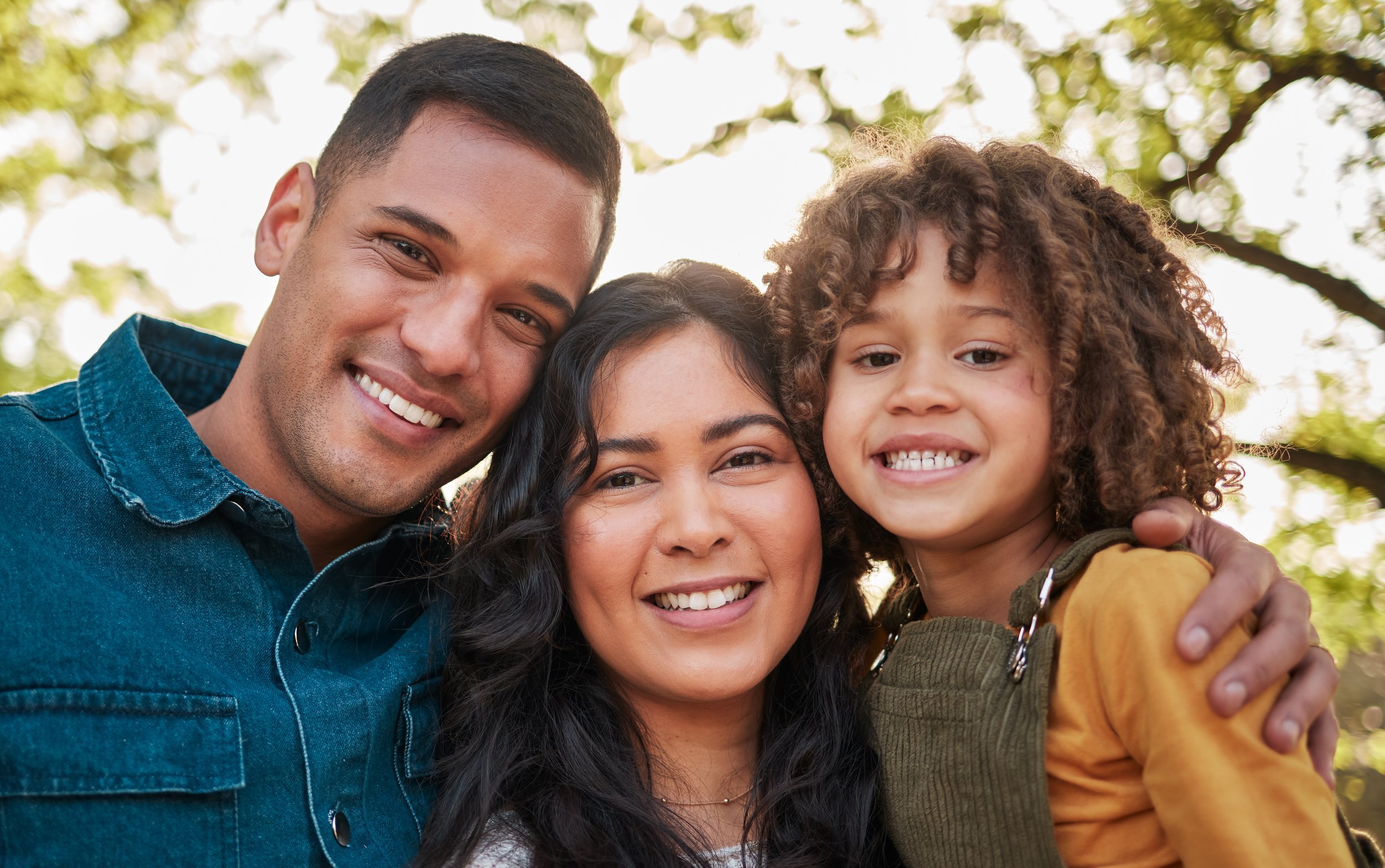 Family Joy: Smiling Small Ethnic Family Portrait - Garden City Family Dentistry