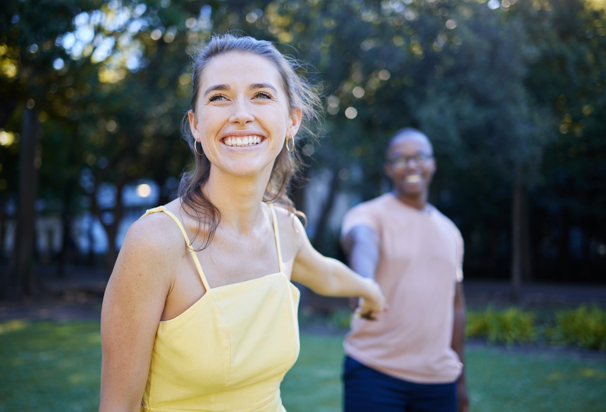 Backyard Bliss: Smiling Couple Holding Hands - Garden City Dental Wellness