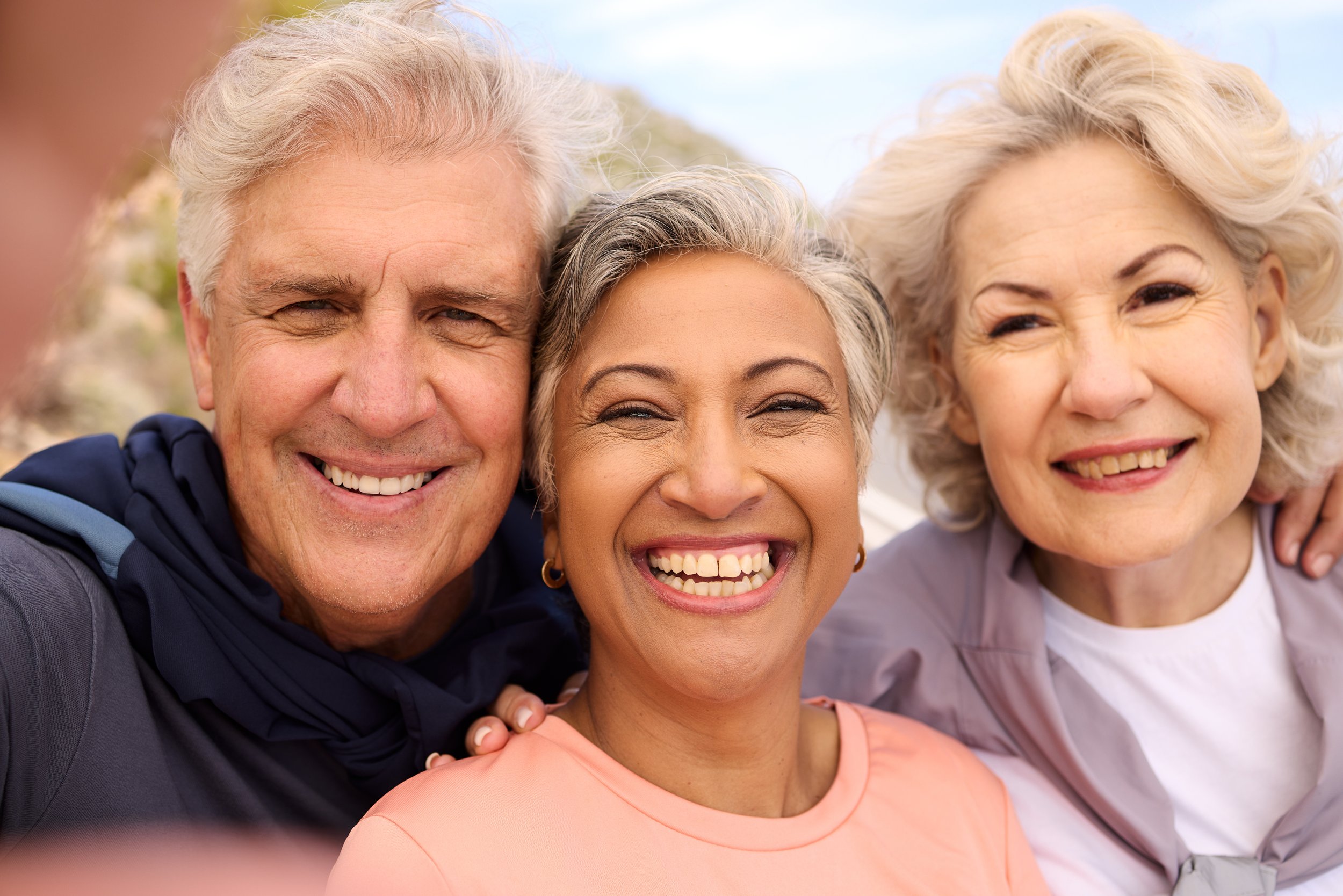 Golden Moments: Elderly Friends' Smiling Selfie - Garden City Dental Care