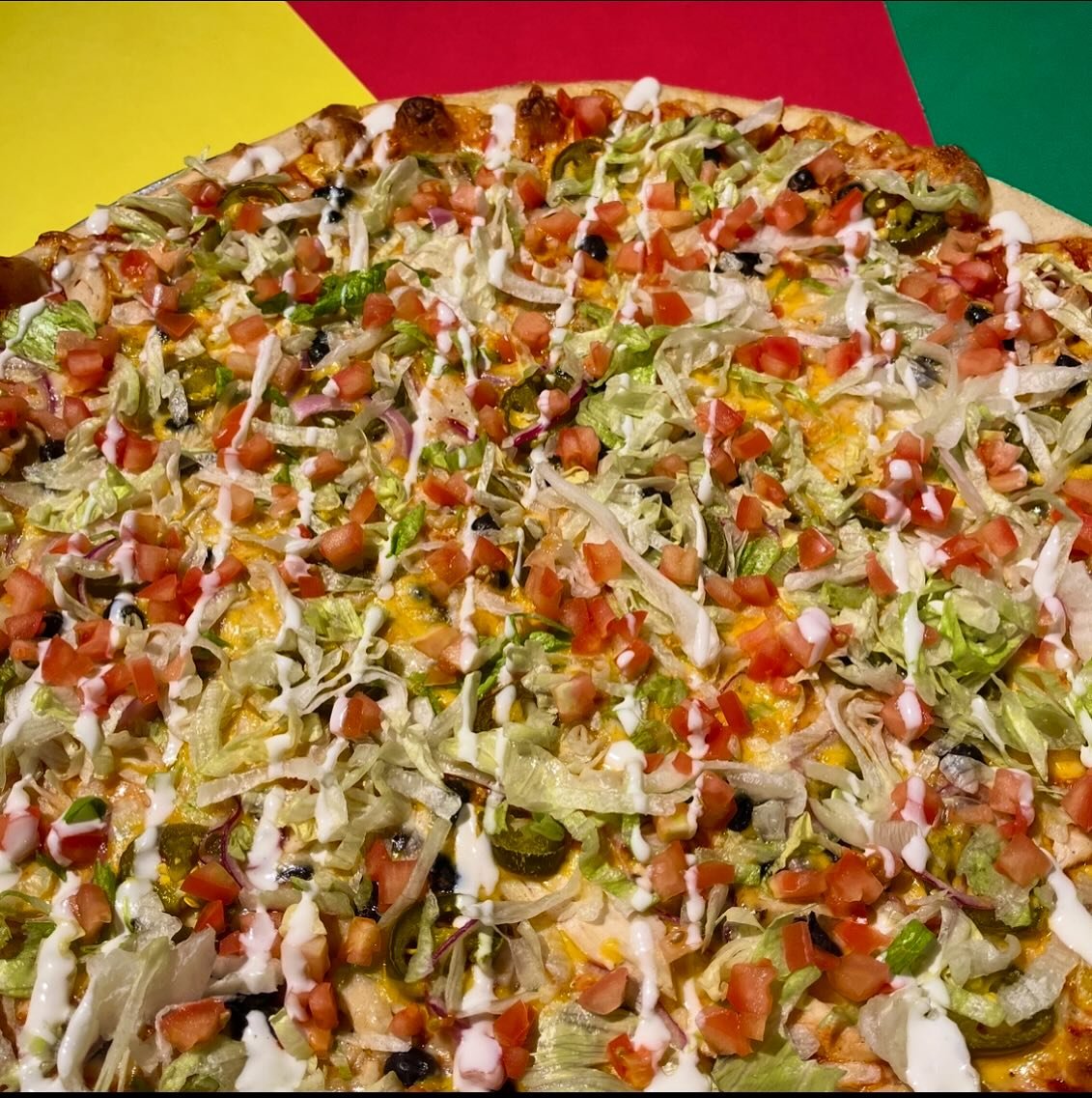 Taco Pizza is back for the month of May! Taco sauce base + mozzarella + cheddar + black beans + fajita chicken + jalapeno + red onion + topped with lettuce + tomato + sour cream drizzle. Available in Germantown and Deer Park. 
#tacopizza #may #pizzao