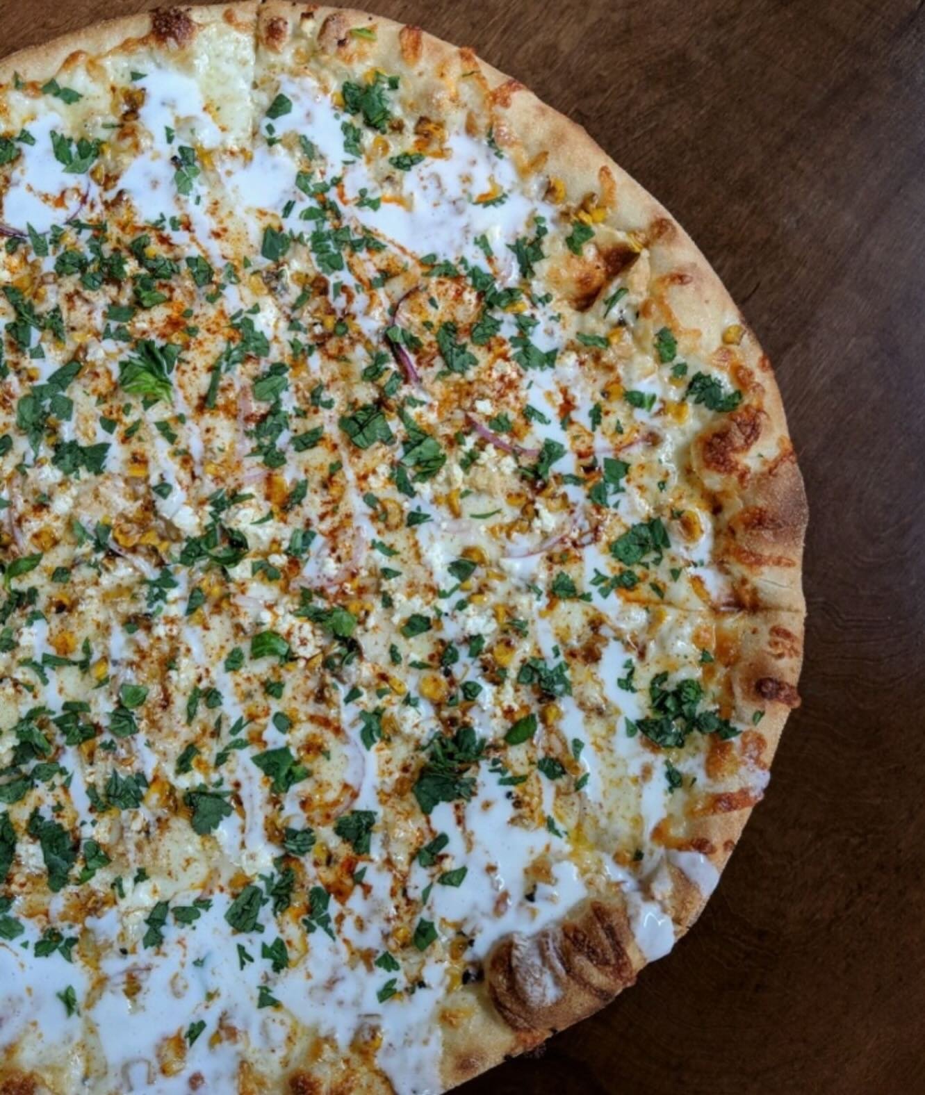 Elote Pizza available for the month of June! Garlic olive oil base + mozzarella + grilled corn + feta + onion + topped with cilantro + chili powder + crema drizzle + served with lime wedges. Available in Germantown and Deer Park!
#pizzaofthemonth #ju