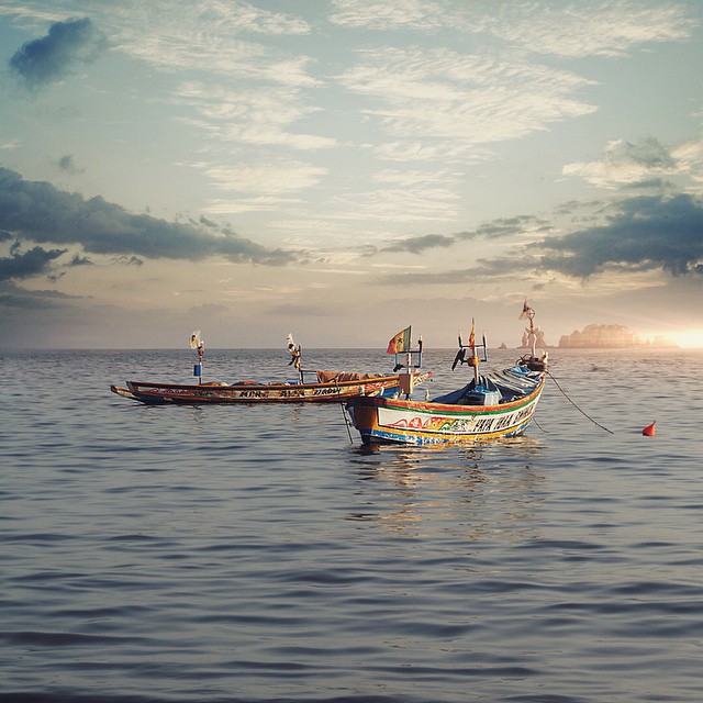 TGIF everyone from the westernmost city in all of Africa and in fact the whole entire Old World...enticing Dakar, Senegal! From our big ship we can spot 2 beautiful &quot;pirogues&quot;. Man! We wish our boat had that cool hand painted style. We're 1