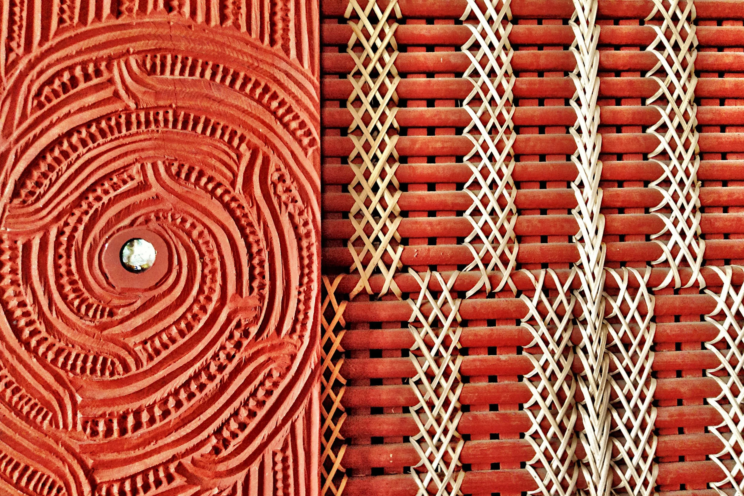 Detail of an ornate carving (whakairo) and woven wall panel (tukutuku) at Te Hahi O Te Whakapono (The Church of the Faith), Rotorua. Commonly known as St. Faith's, the first Christian church service in Rotorua was held here on October 30, 1831.