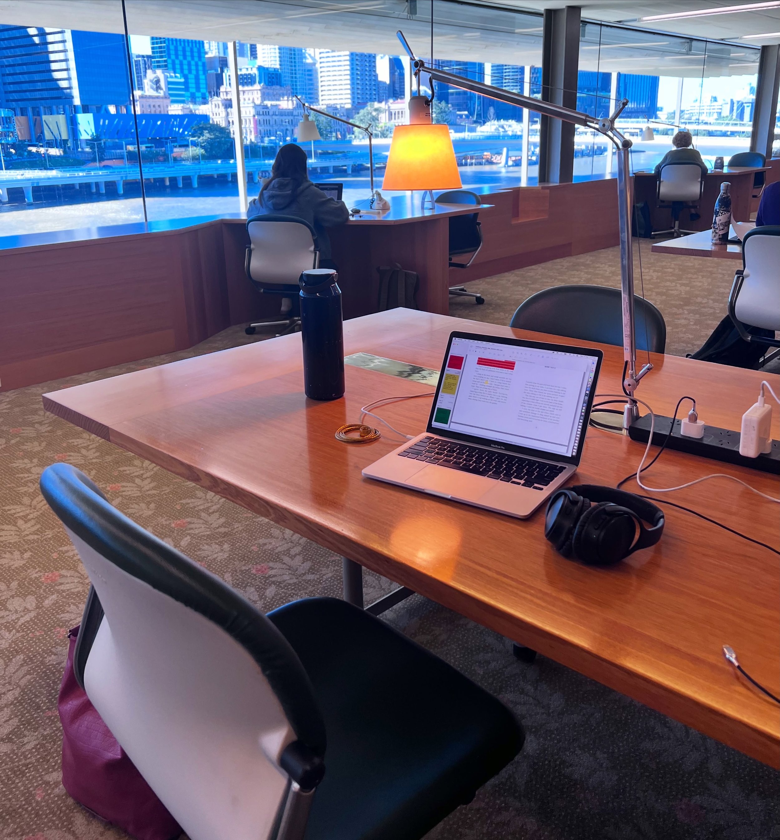 This week I am reviewing the proofs of my next novel, The Wave, at this beautiful desk on the fourth floor of the Queensland State Library. 

This is the quiet room, with a view over the Brisbane River, big timber desks and a wonderfully studious hus