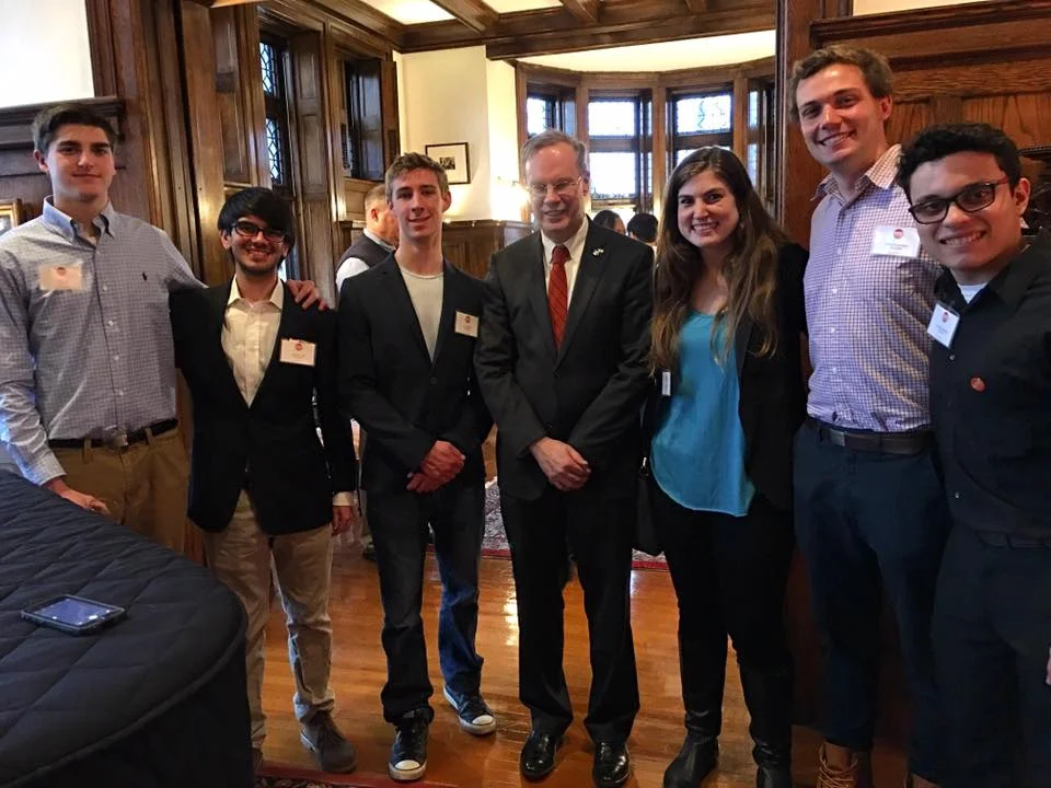 Eric Cola, Gabriel Ortiz, Will Carrara, Chancellor Kent Syverud, Shira Stoll, Elliot Greenwald, and Christian Merced Cruz at the Chancellors house in Syracuse, NY.