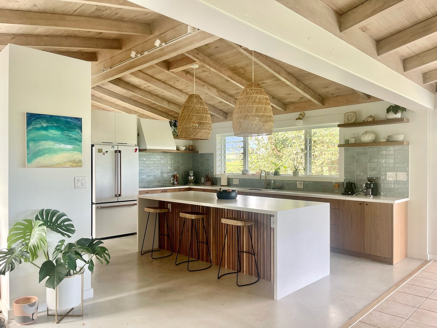 Living the island life!  Clean and light with a splash of color.  The walnut wood veneer blends seamlessly with the other kitchen details, while the ultramatte white adds some brightness at the refrigerator wall. 

Main cabinetry:  Frozen Walnut wood