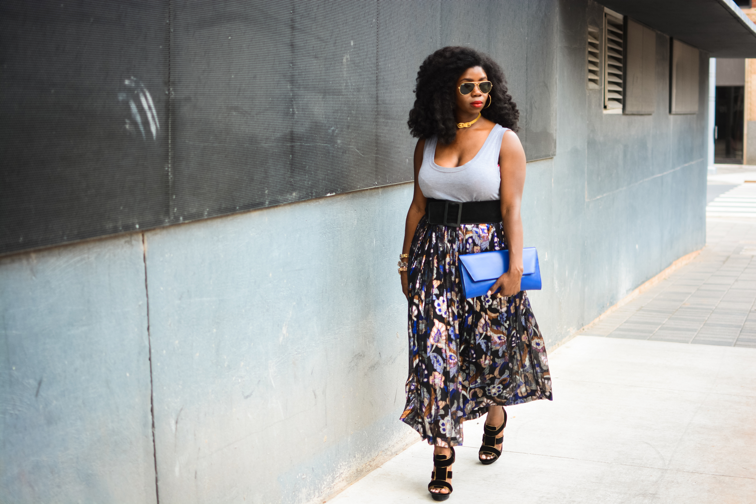 Shades - Ray Bans (seen here) | Gold choker - Vintage (similar here) | Grey Shir t - The Gap (here) | Belt - Dillard's OLD ( similar here ) | Skirt - Thrifted from Bad Granny's Bazaar. (similar here) | Shoes - Tory Burch (here ) | Bracelets - Nordstrom (similar here) | Clutch - (seen here) | Earrings - (seen here). 