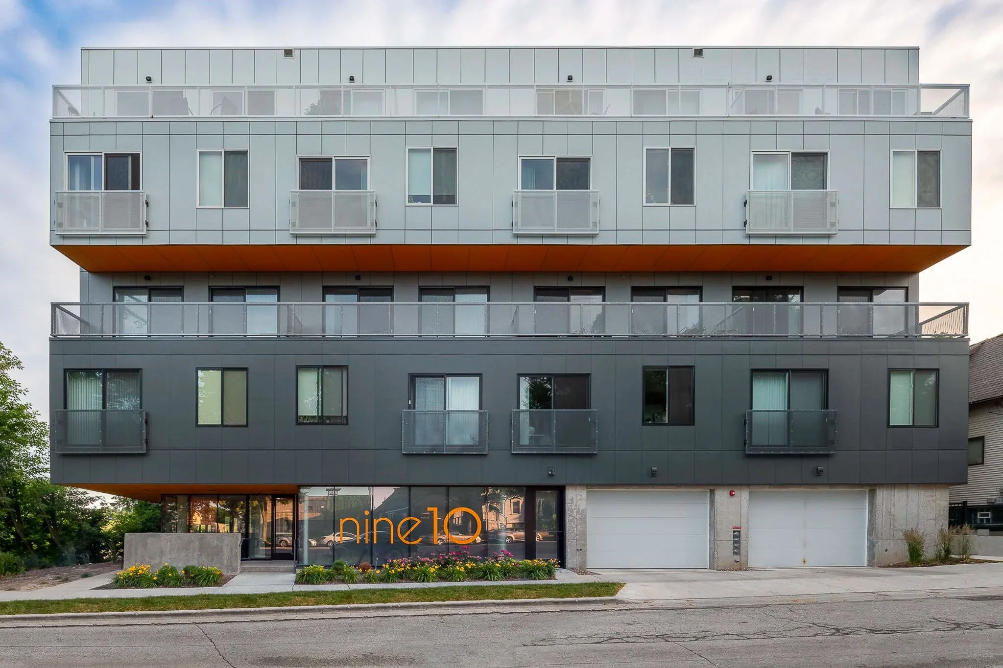 Modern Nine10 residential building exterior with clean lines and contemporary facade — Milwaukee residential architecture photography