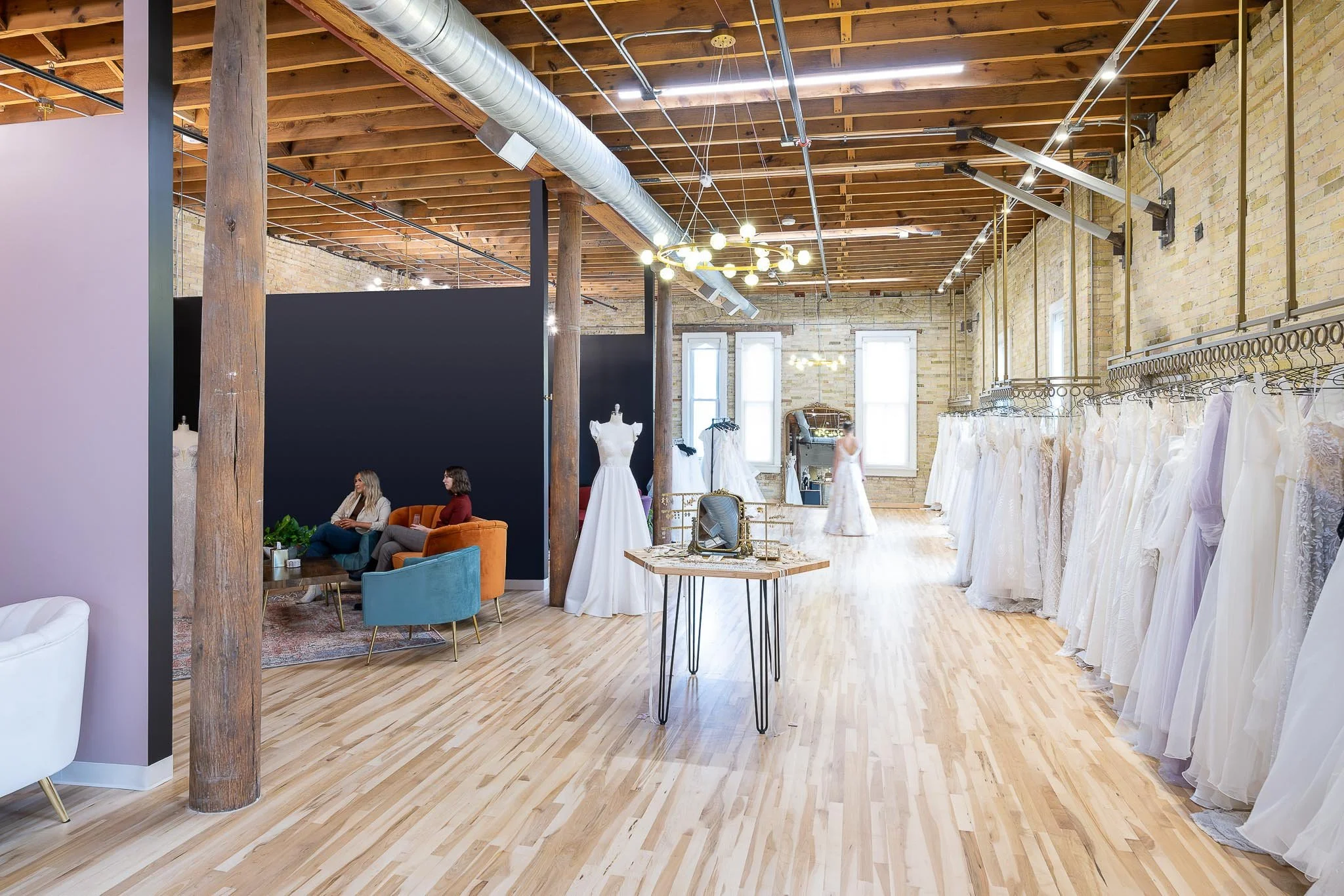 Elegant bridal boutique interior with wedding gown displays and soft natural light — Milwaukee commercial interior photography