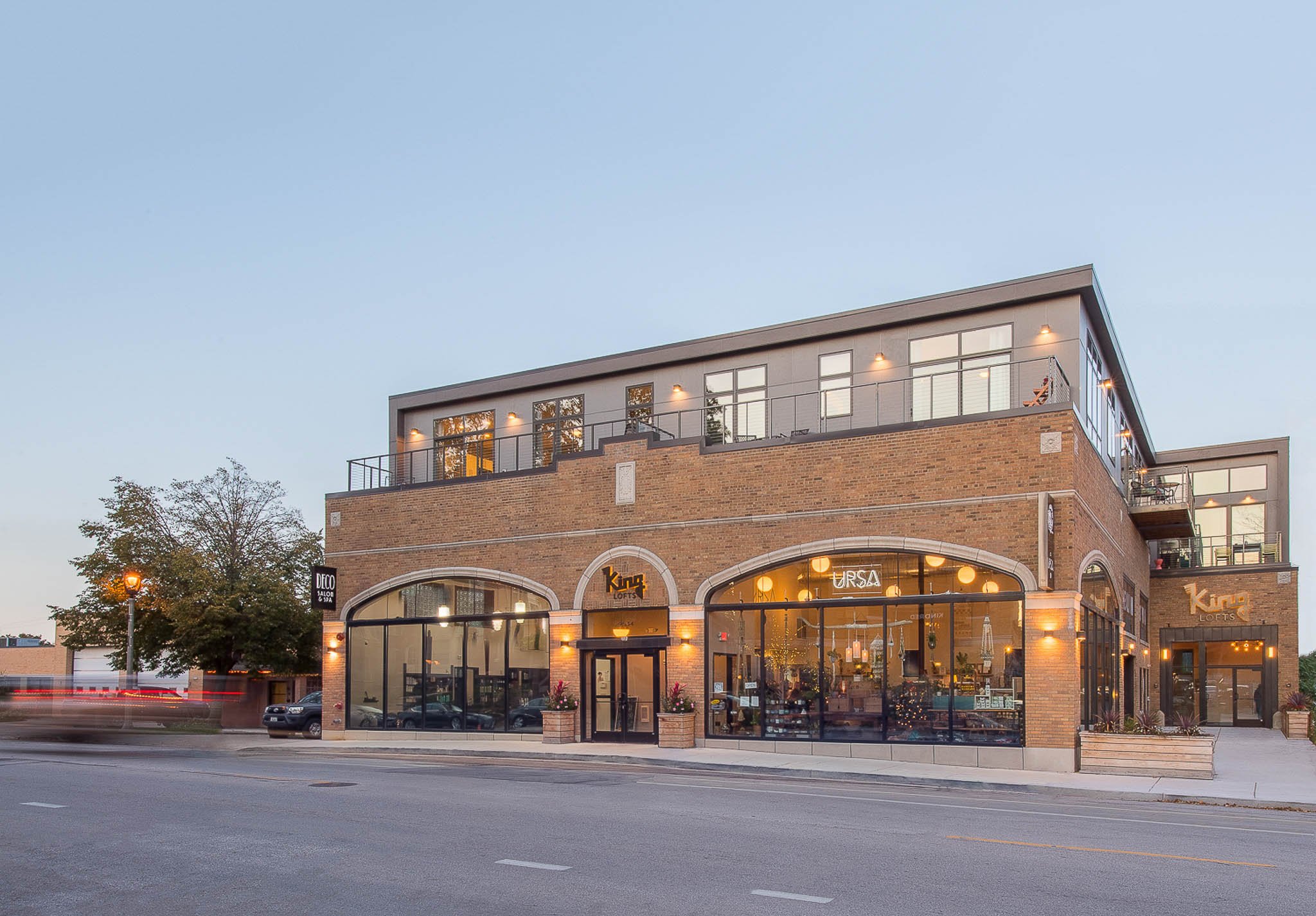 Milwaukee King Lofts mixed-use building with warm dusk lighting and urban streetscape — Milwaukee commercial architecture photography