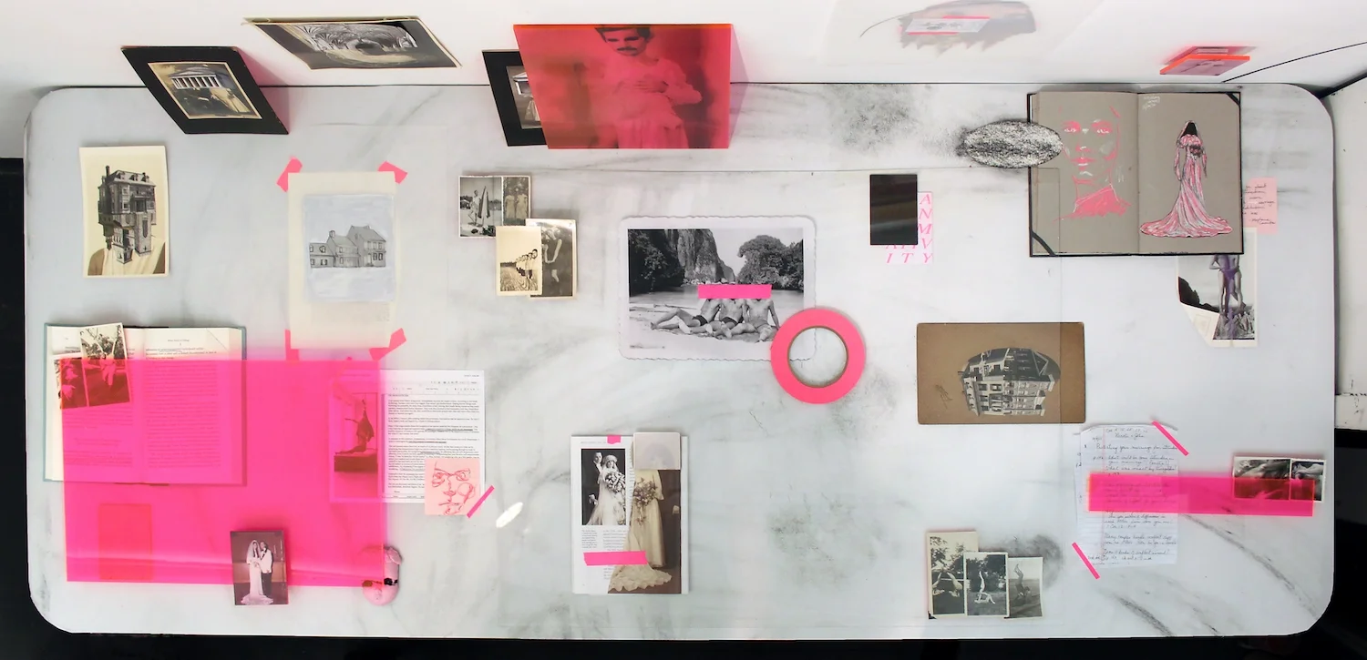 Amatonormativity (First State), 2017, archival ink jet prints, table, books, plexiglass, charcoal on paper, collage, found photographs, vinyl, & tape, dimensions variable
