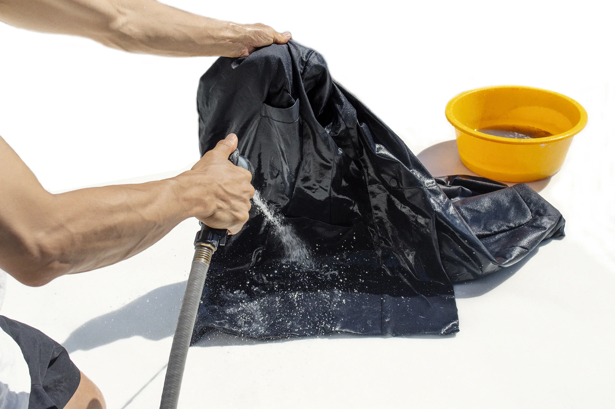Step 1. Using the garden hose, give the coat a good coating of water to dampen it , and loosen the dirt build up over the years