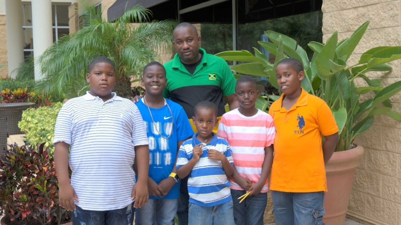 5 Scholastic players with their chess coach who traveled to the tournament from Jamaica!