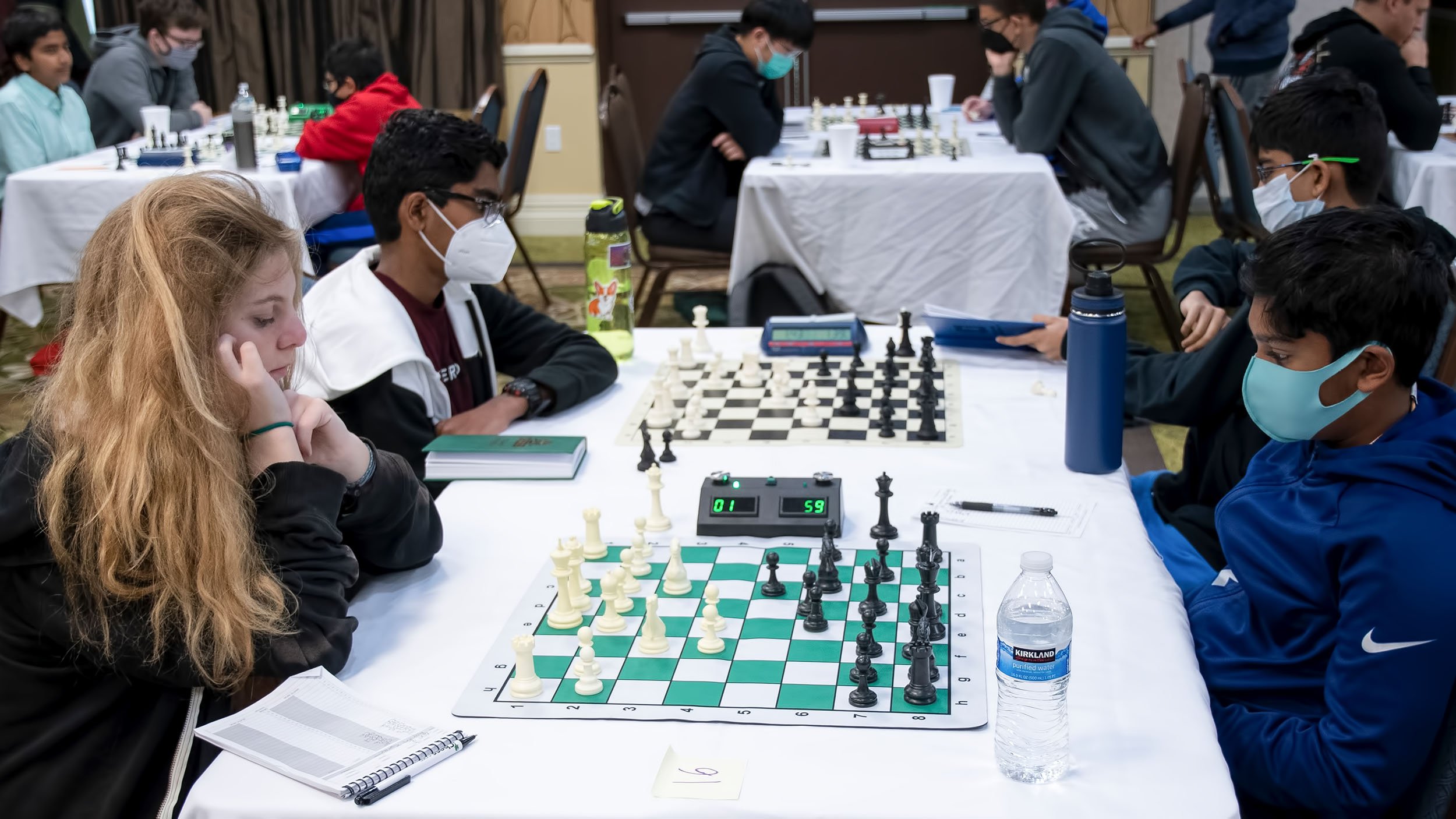 Students check out the CCPS winter chess tournament