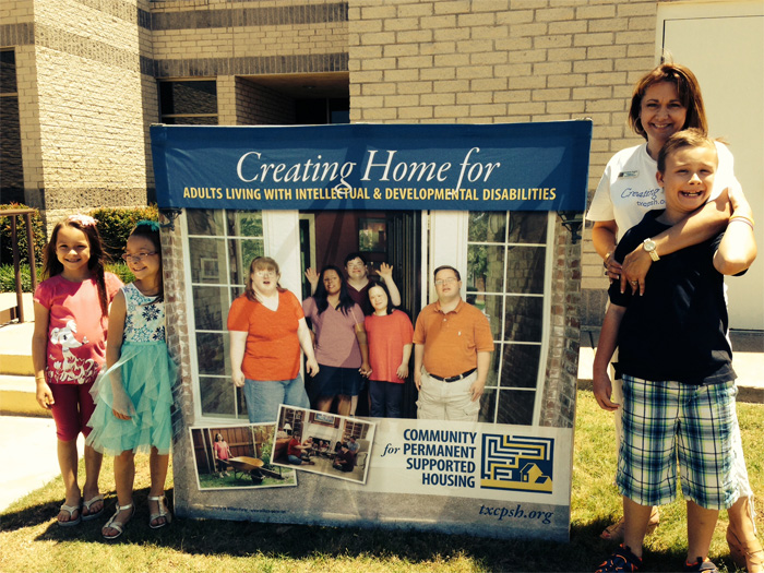 Kimberly Rogers and chlidren, Kate, Kennedy, and Hayden volunteered to assist at the community meeting