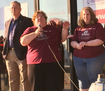 At the ribbon cutting, from left, Garland Mayor Douglas Athas, Founder of Emma's Education Center, MARIE JOSEE QUENEAU, and Emma Queneau.
