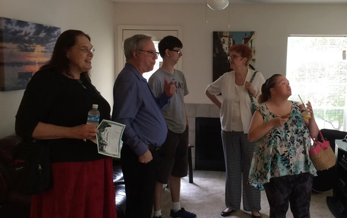 parents at open house DISCUSSING Apartment living