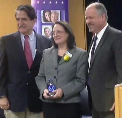 Robin receiving the Vision award for her work on behalf of those who need housing.