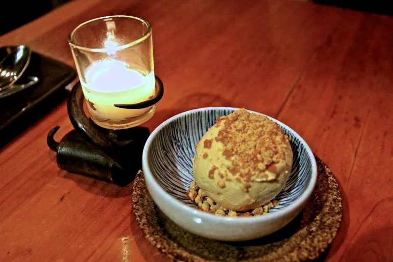 Frozen single scoop of homemade peanut butter ice cream