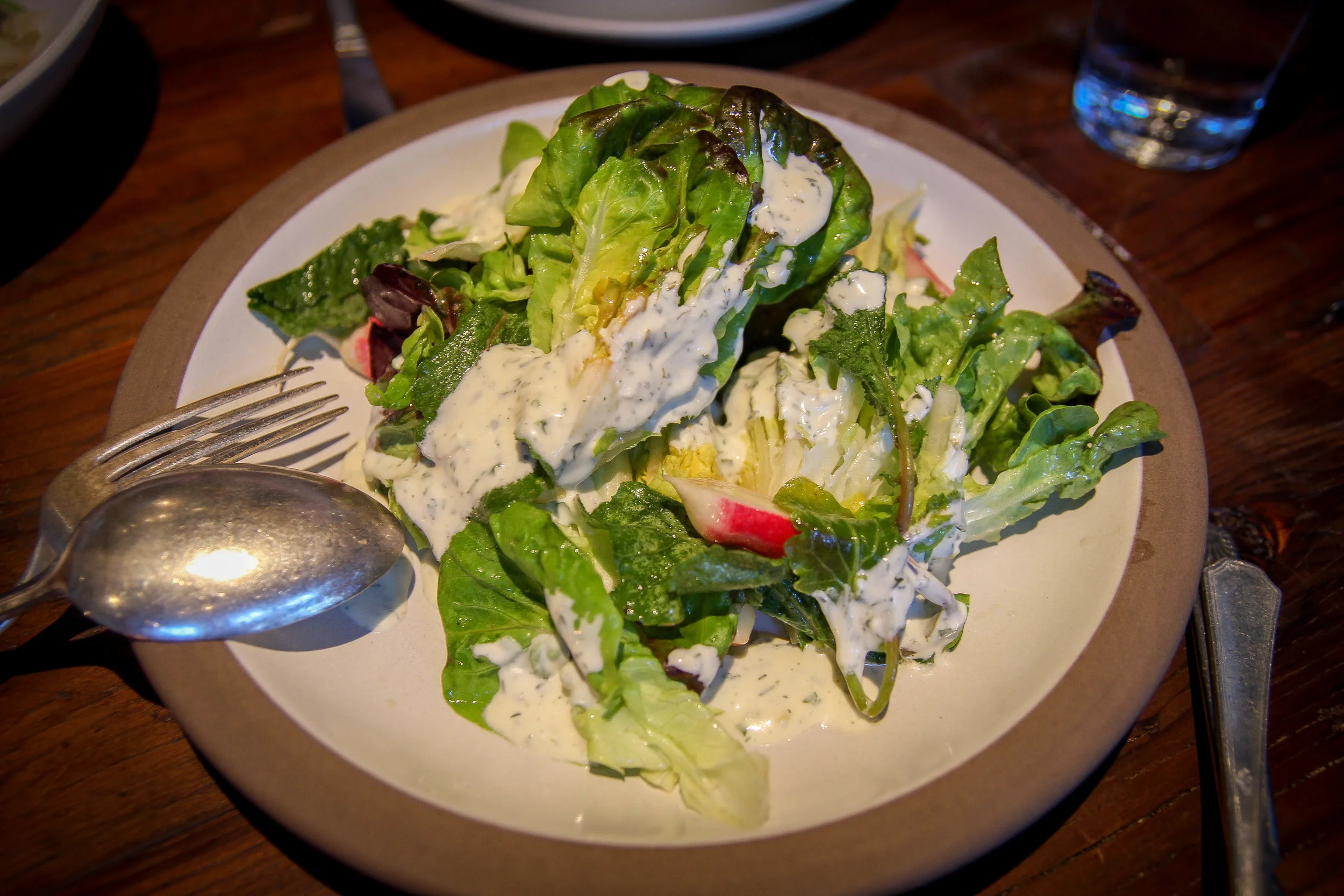 Gem lettuce salad with ramp'eh, radish, and croutons