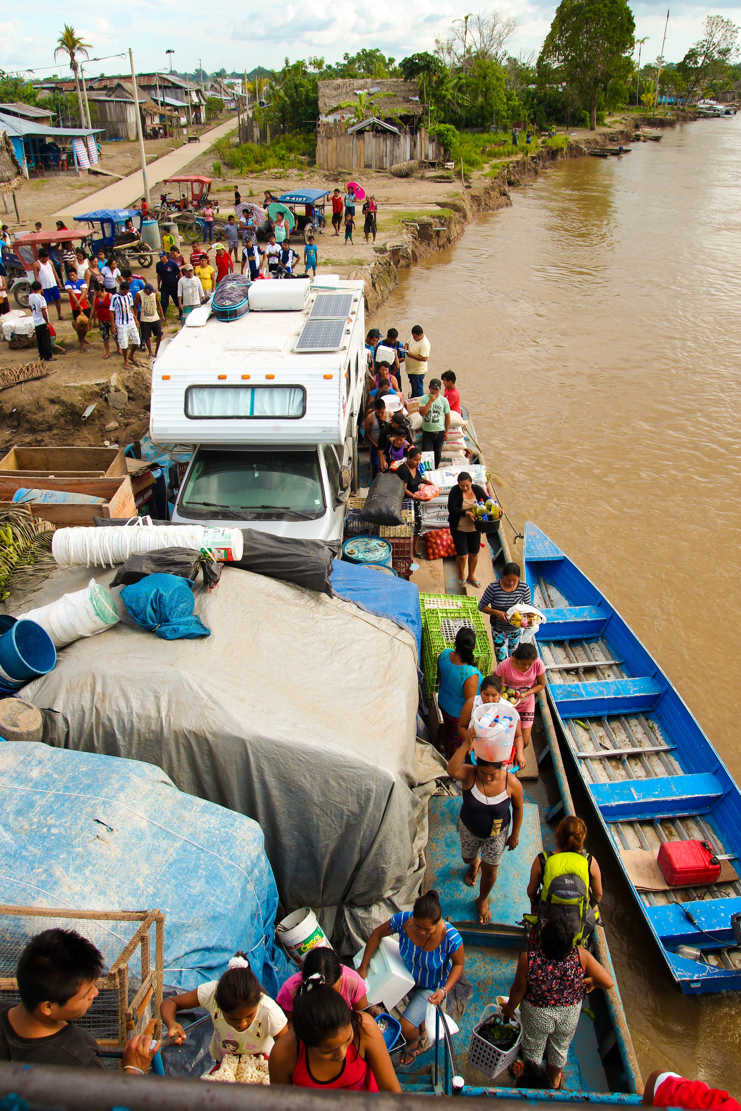 Flow of people on and off of the boat while docked at a village along the Amazon River.