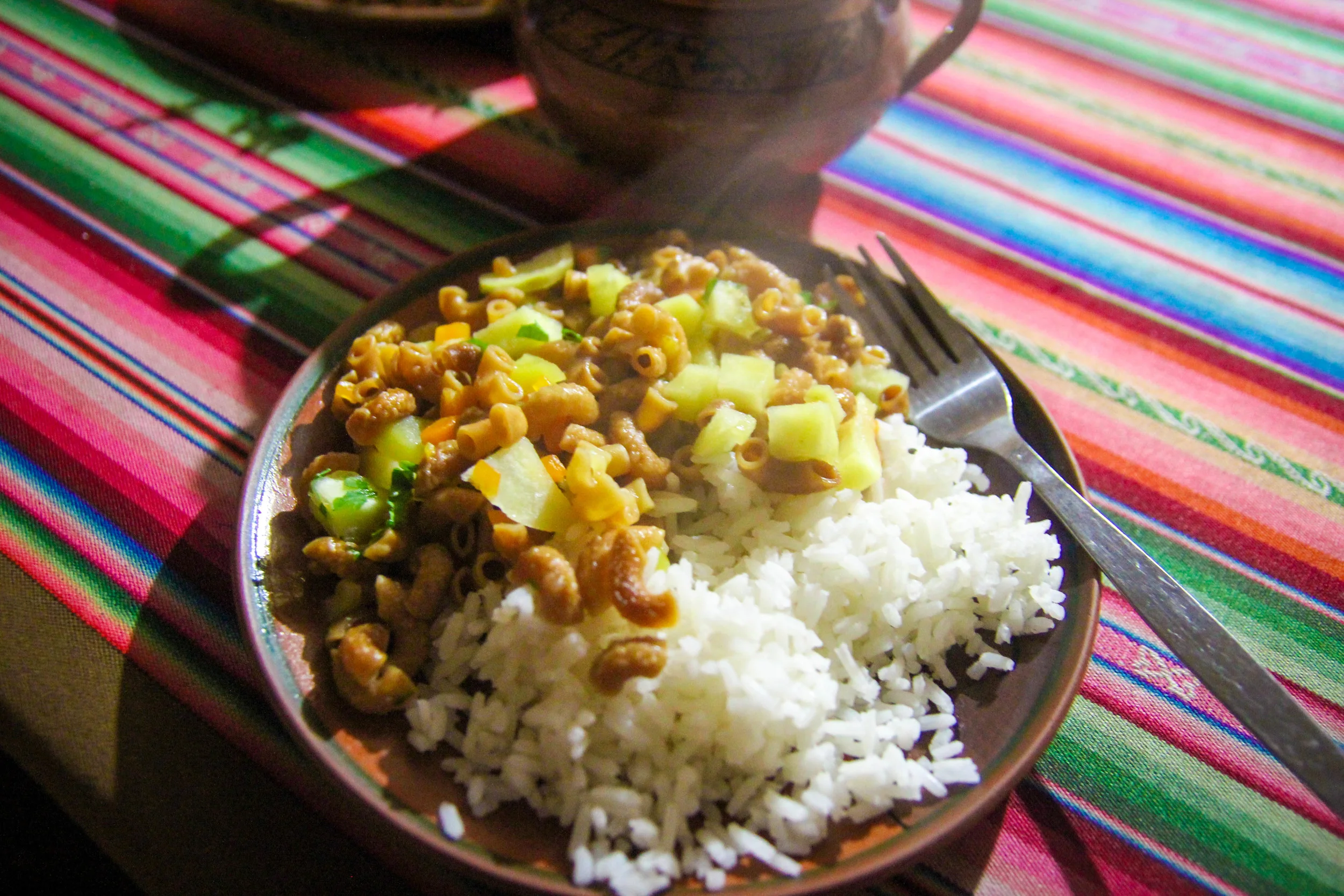 Rice with pasta. It is not unusual to pair carbs with carbs in Peru.