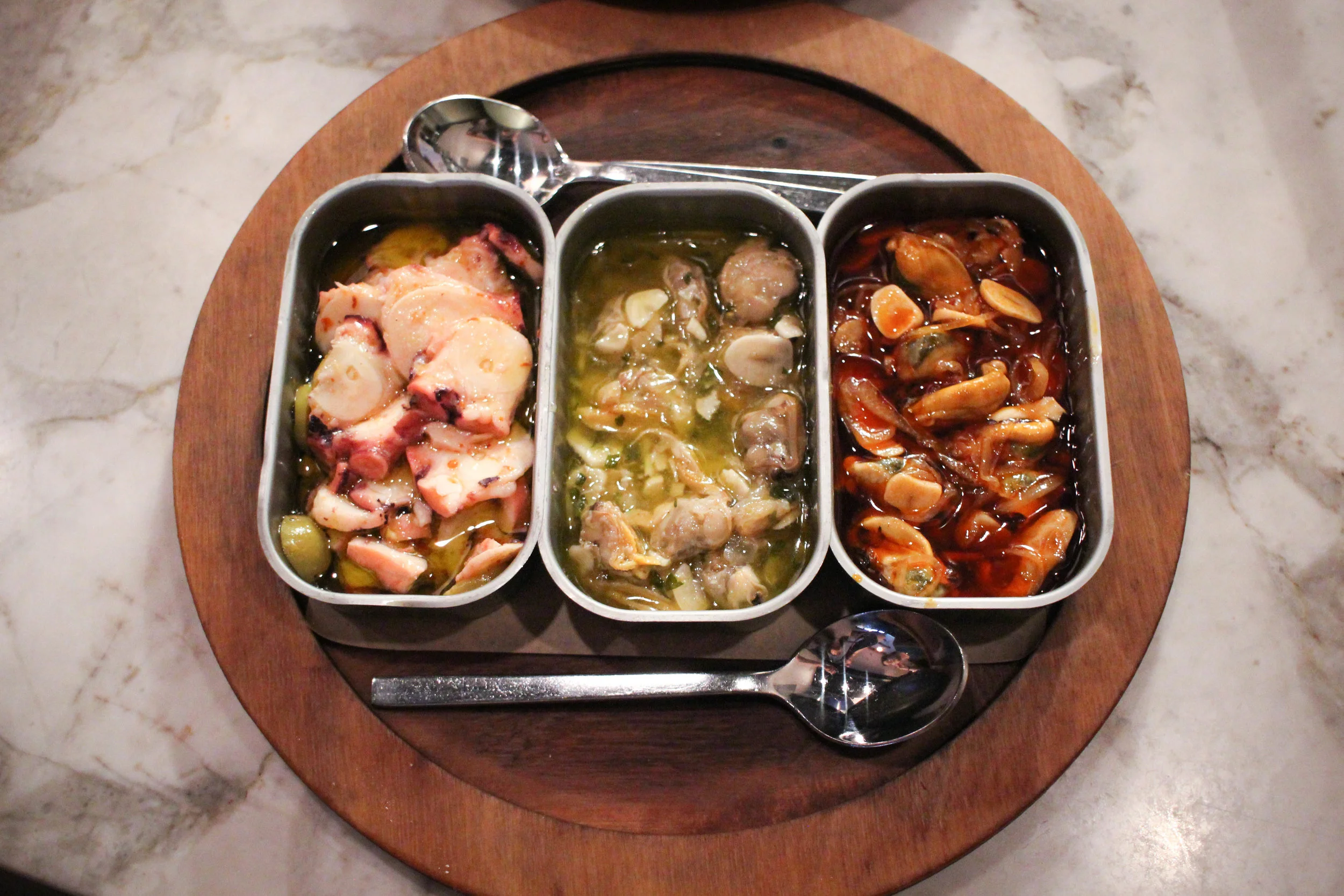 Conserva Flight (marinated seafood) 1. Mussel escabeche 2. Clam escabeche verde 3. Octopus and green olive