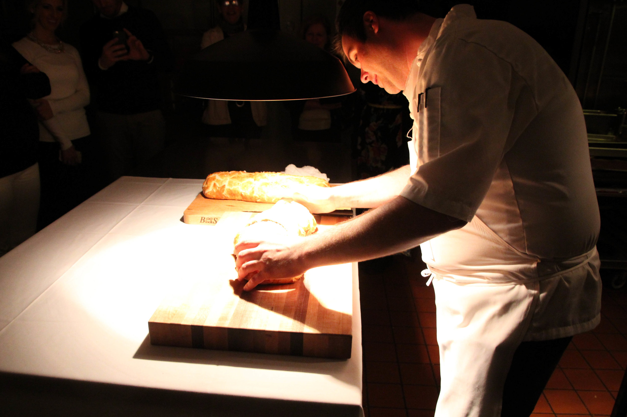 Slicing open the baked beef Wellington