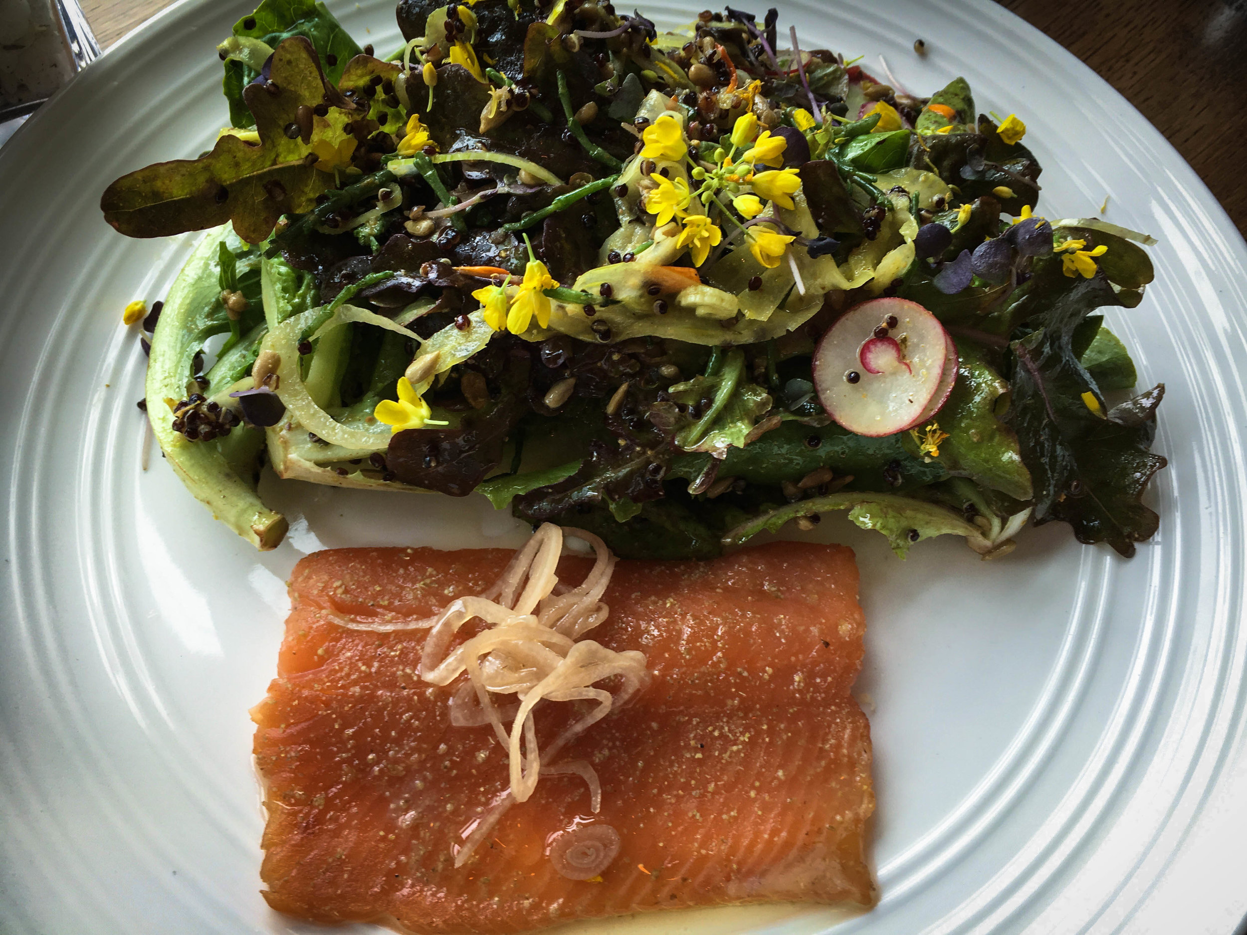 Smoked Lomi Trout with whole baby greens salad, toasted sesame vinaigrette, radishes, grilled taro sweet bread