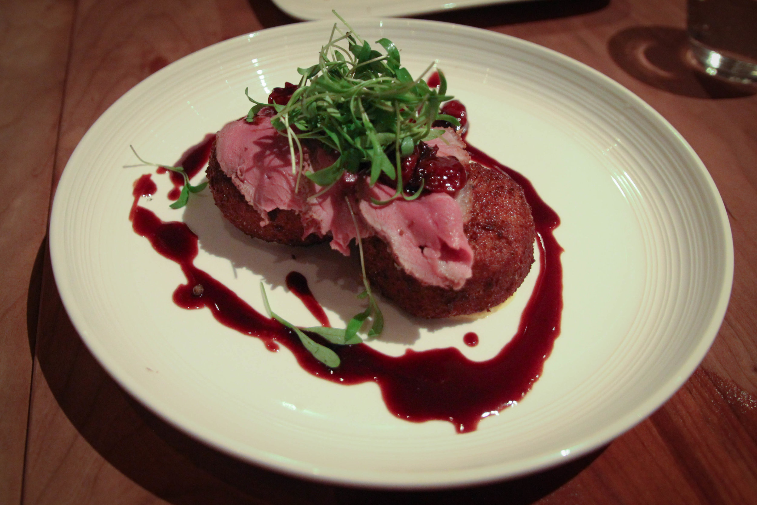 Arroz de Pato: roasted duck breast, duck confit-mushroom risotto fritter, dried cherries, red wine reduction
