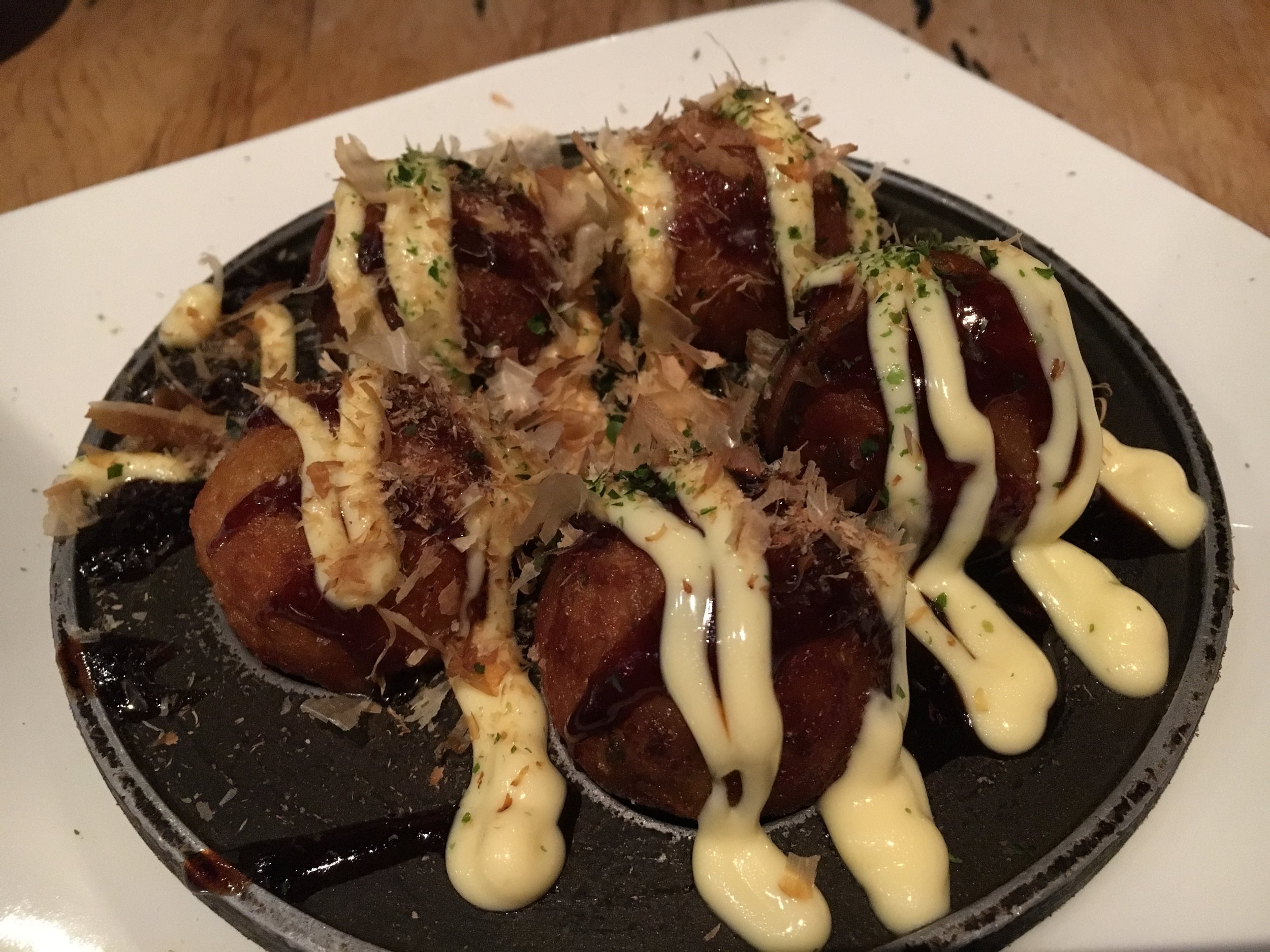 Takoyaki: fried octopus, battered balls with Japanese mayo and bonito fish flakes